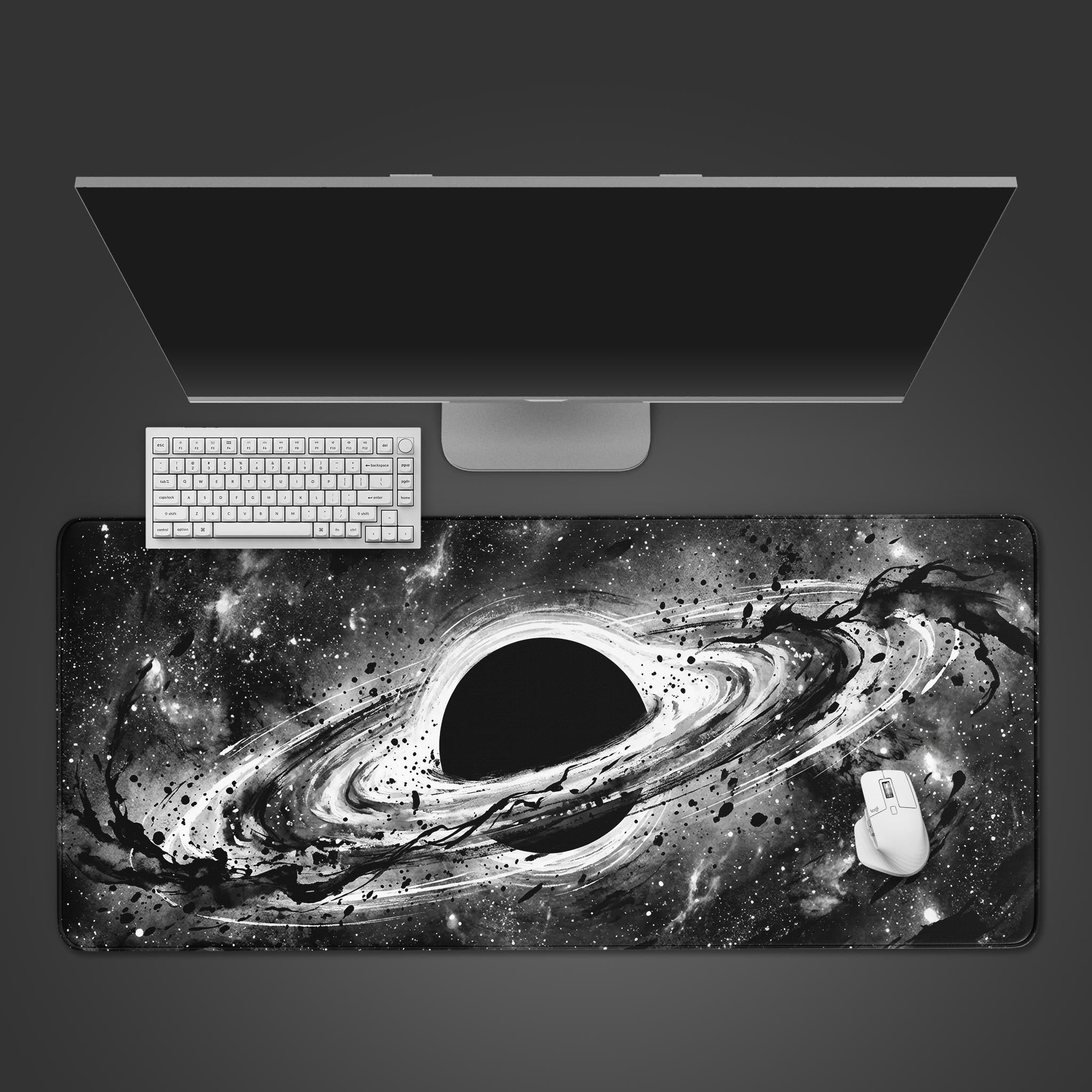 The Eternal Void desk mat with its swirling black hole design, shown from a top-down view with a black keyboard and wireless mouse. - Epic Design Pads & Mousepads