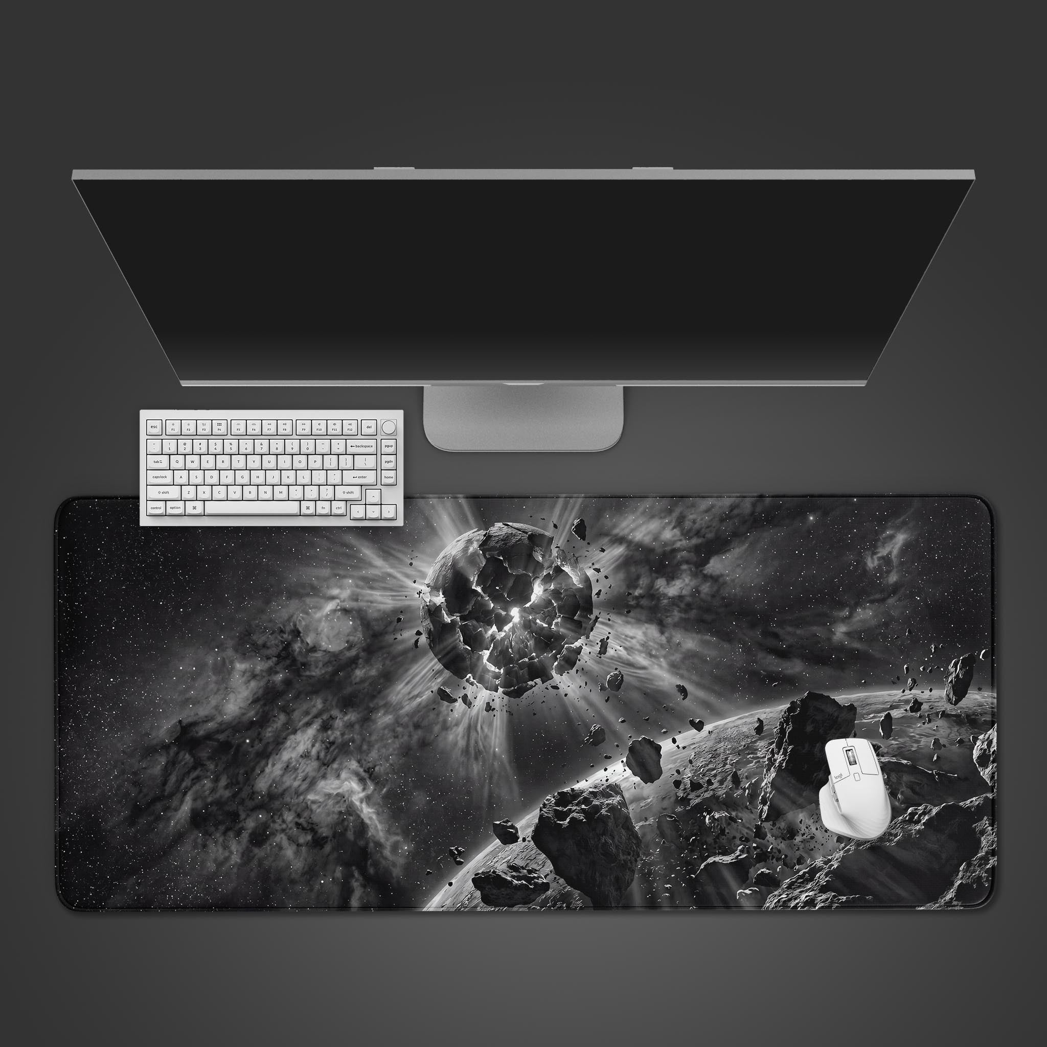 Black and white Shattered Planet desk mat featuring an exploding celestial body in deep space.