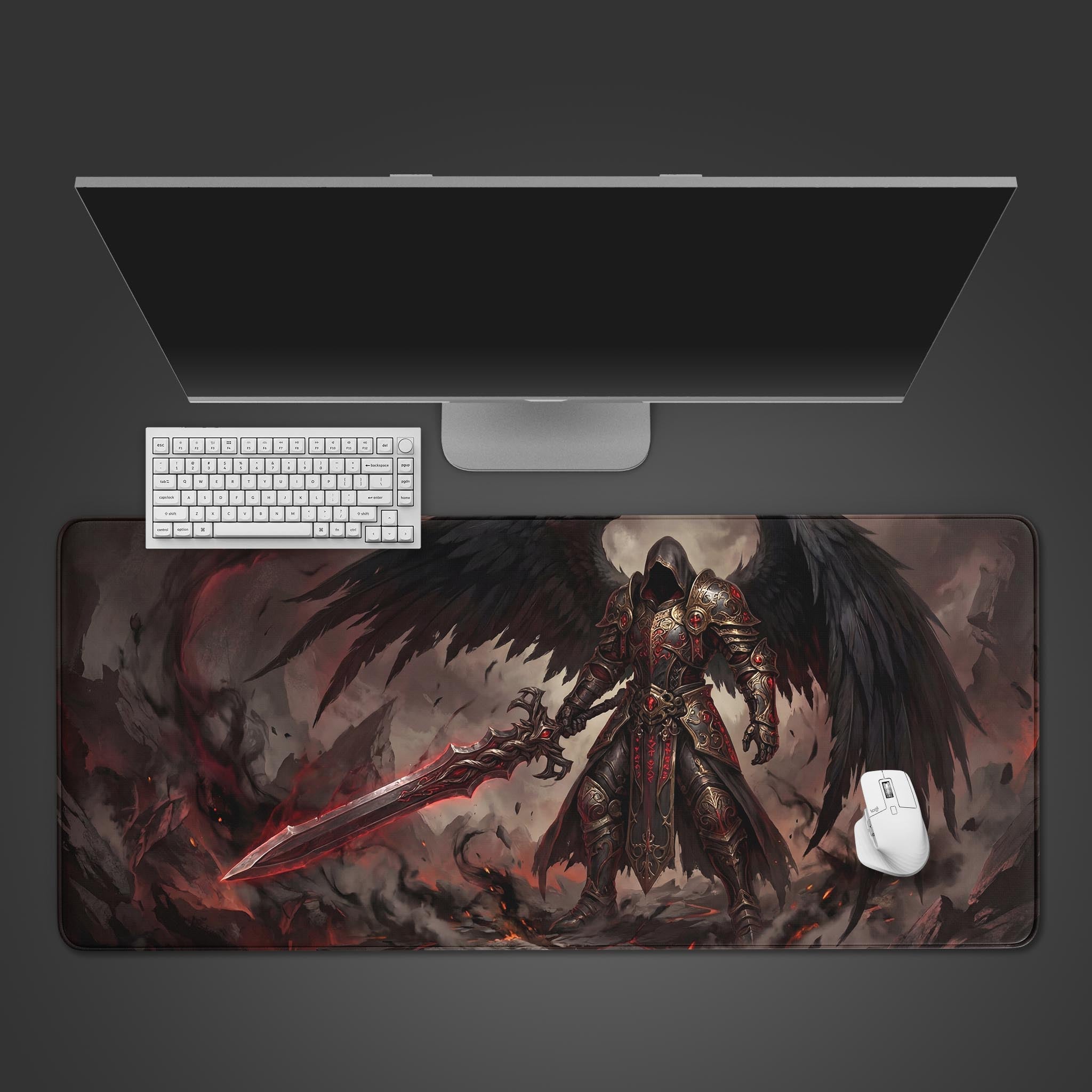 Top-down view of the Fallen Angel gaming desk mat, featuring a dark warrior with black wings, shown with a white keyboard and mouse on a clean desk. - Epic Design Pads & Mousepads