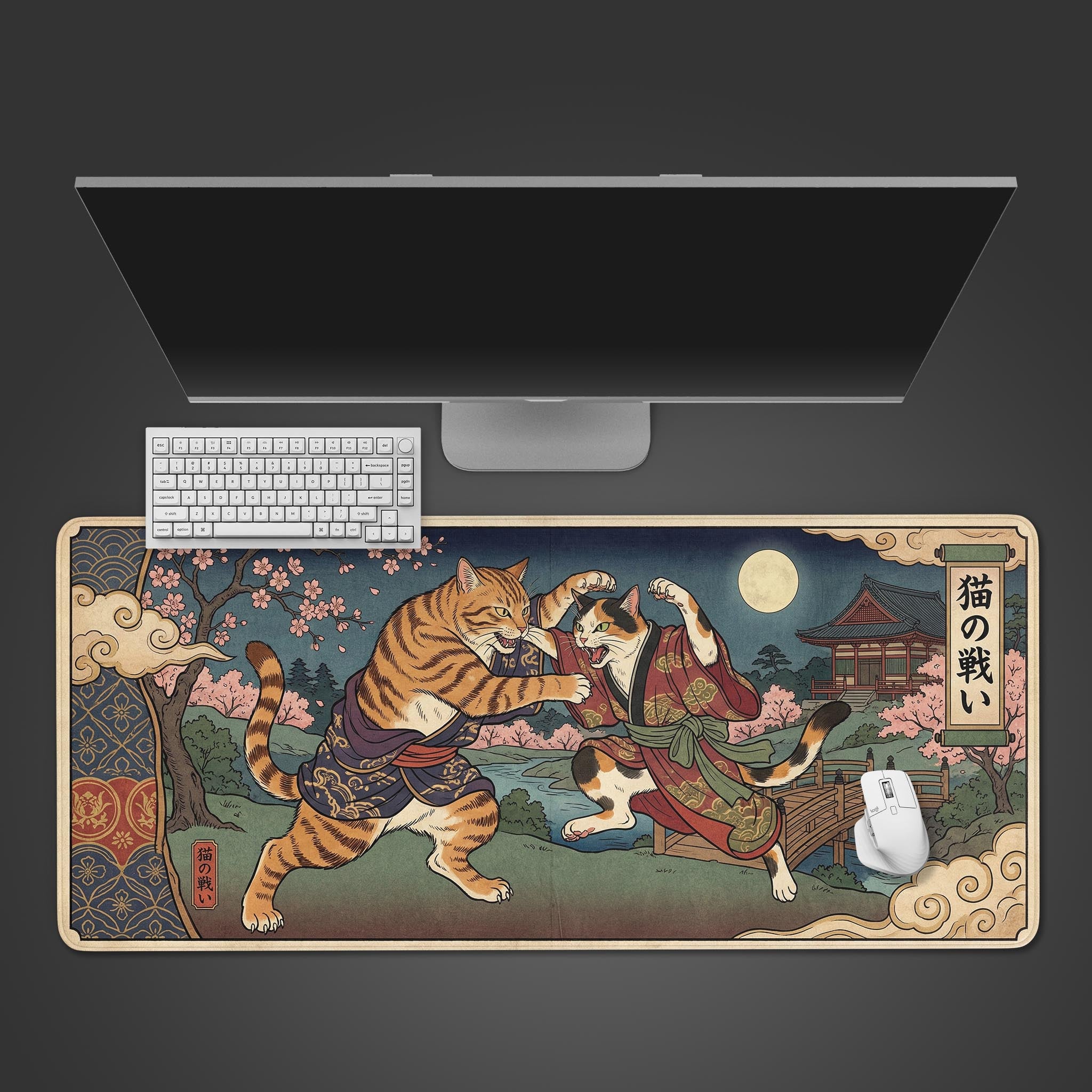 Feline Tussle Japanese desk mat in Ukiyo-e style. Top-down view on a desk with a keyboard and mouse, showcasing the dynamic cat artwork. - Epic Design Pads & Mousepads