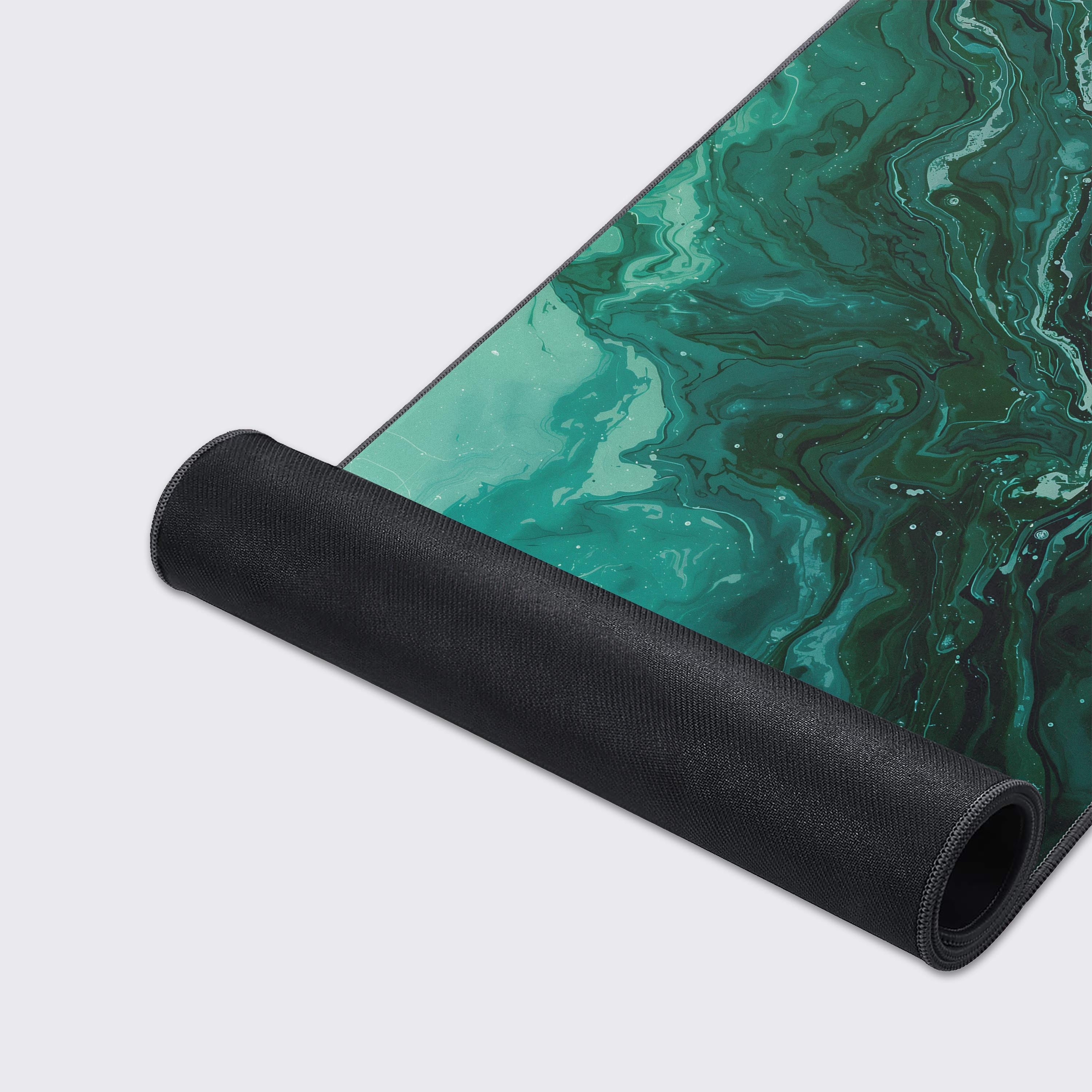 Detail showing the water-proof and easy-to-clean smooth surface of the green marble mouse pad