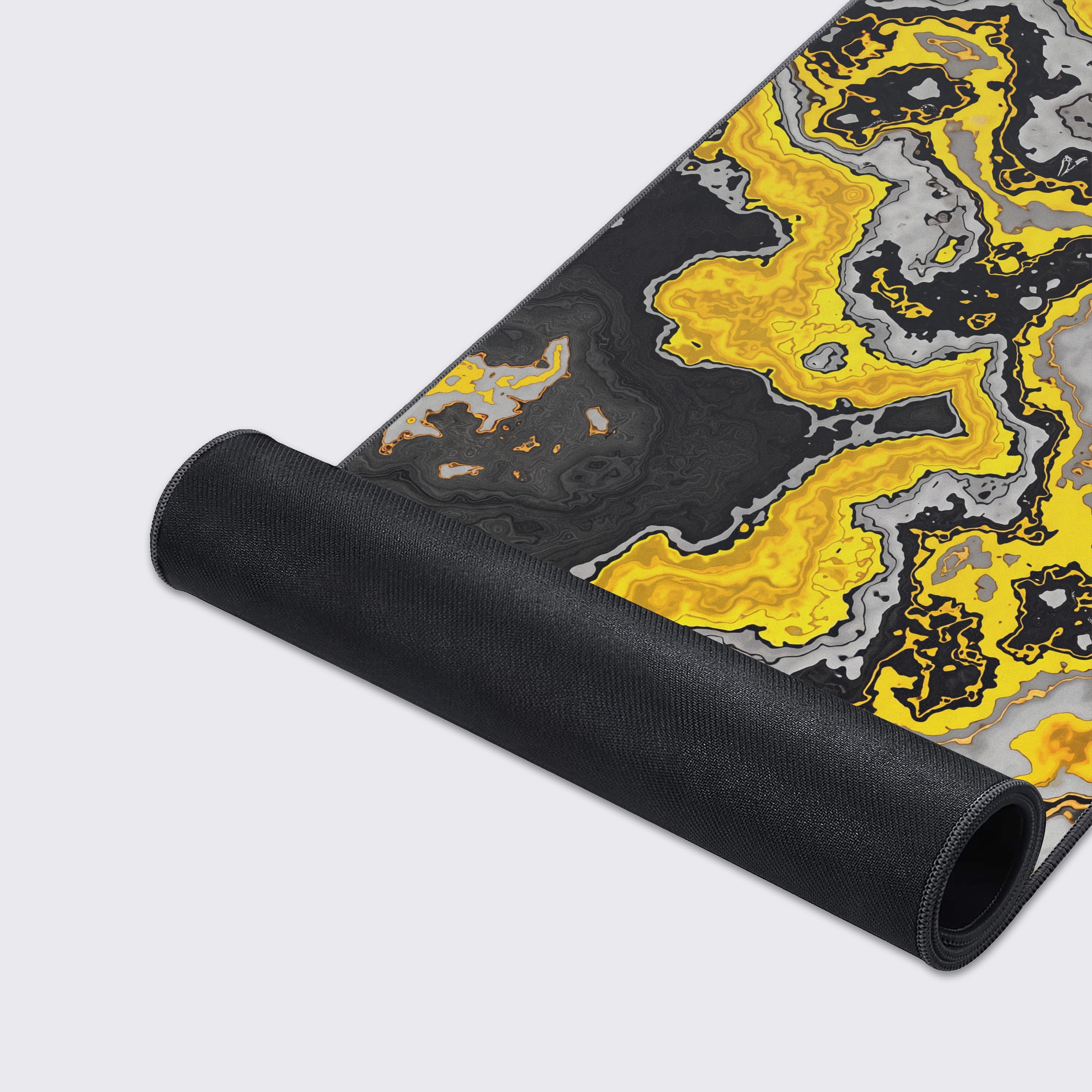 Non-slip rubber base detail of the Molten Gold fluid art desk mat