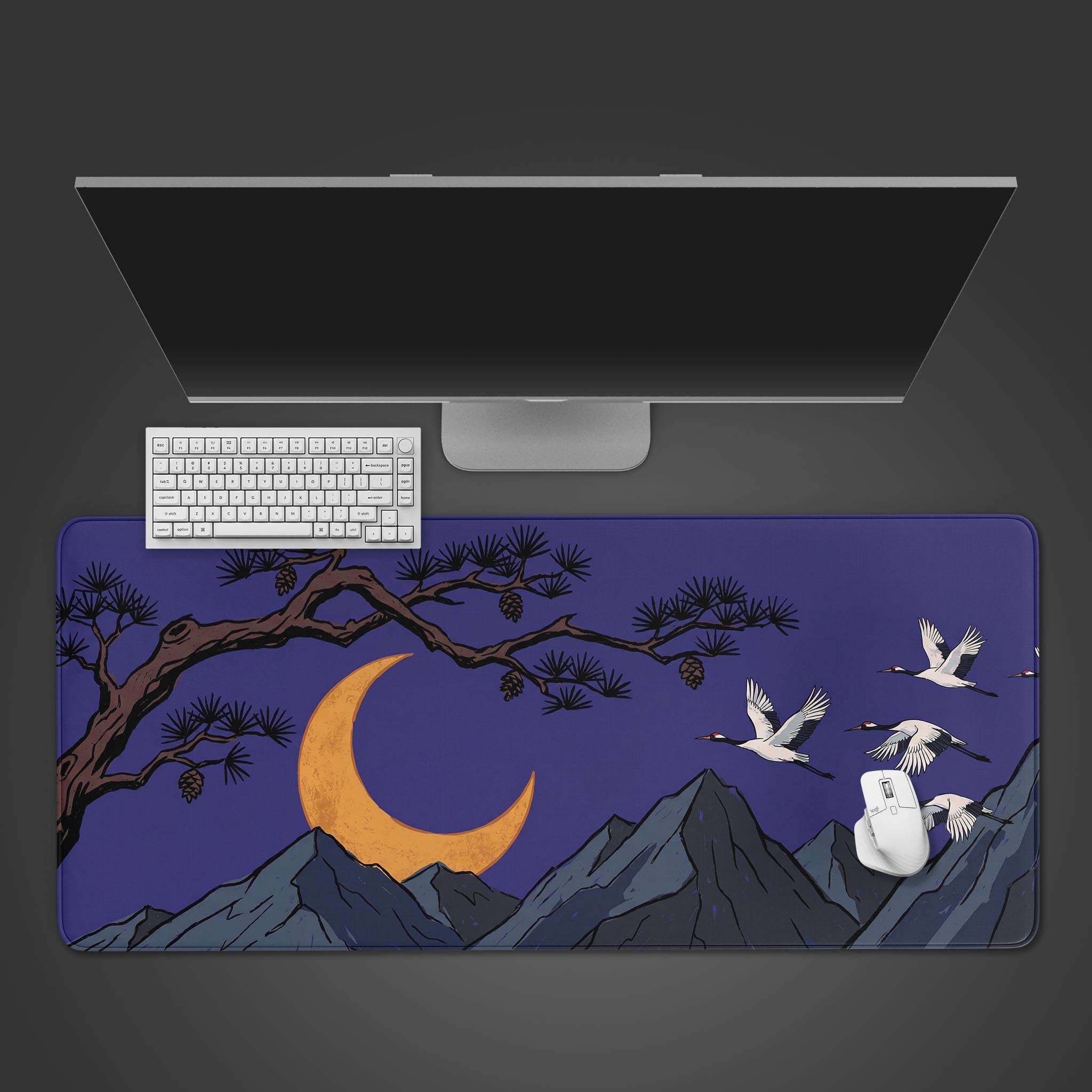 Moonlit Cranes desk mat featuring flying white cranes, a golden crescent moon, and pine branches against a dark purple night sky.
