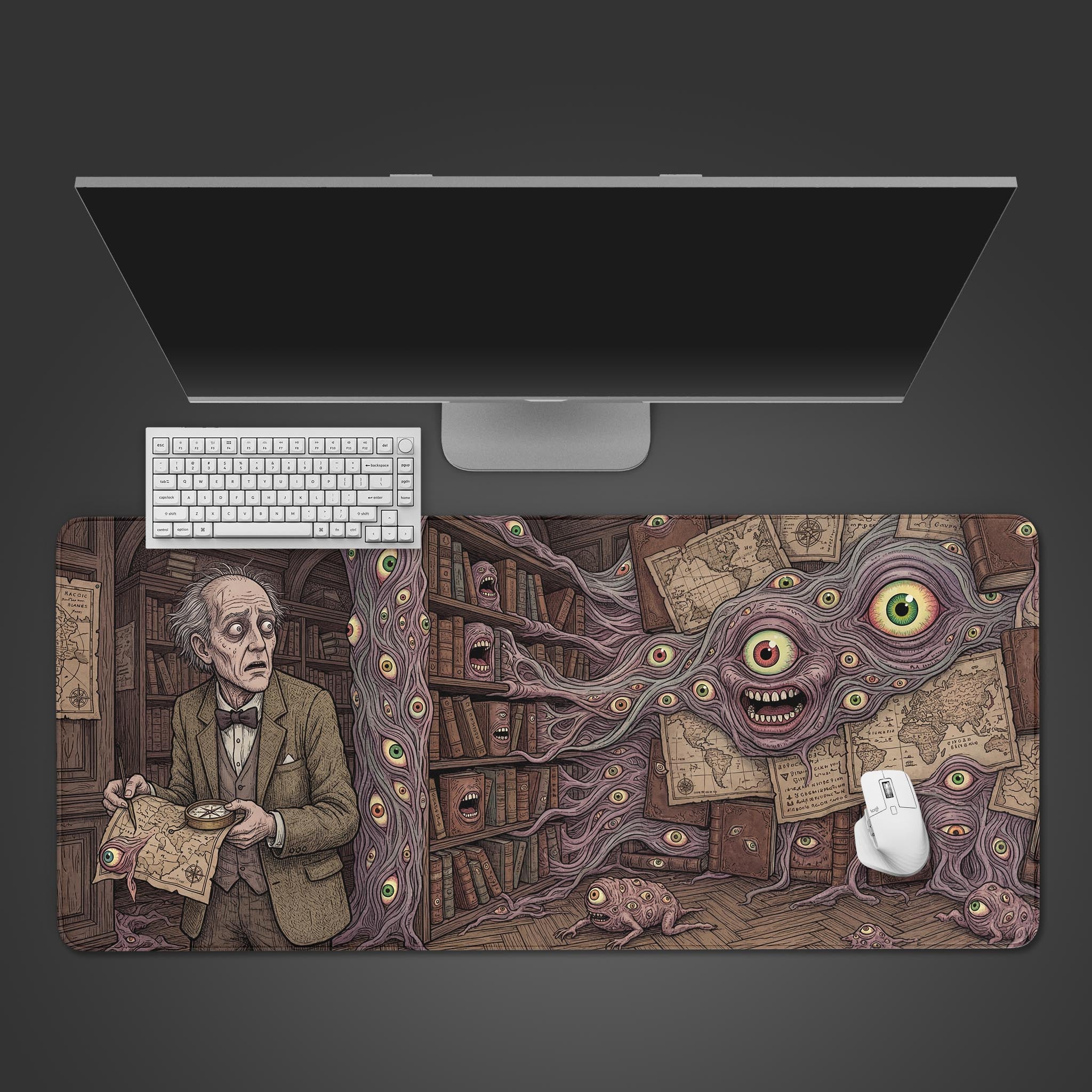 Top-down view of the Forbidden Knowledge gaming desk mat, showing the eldritch horror library scene with a white keyboard and mouse under a monitor. - Epic Design Pads & Mousepads