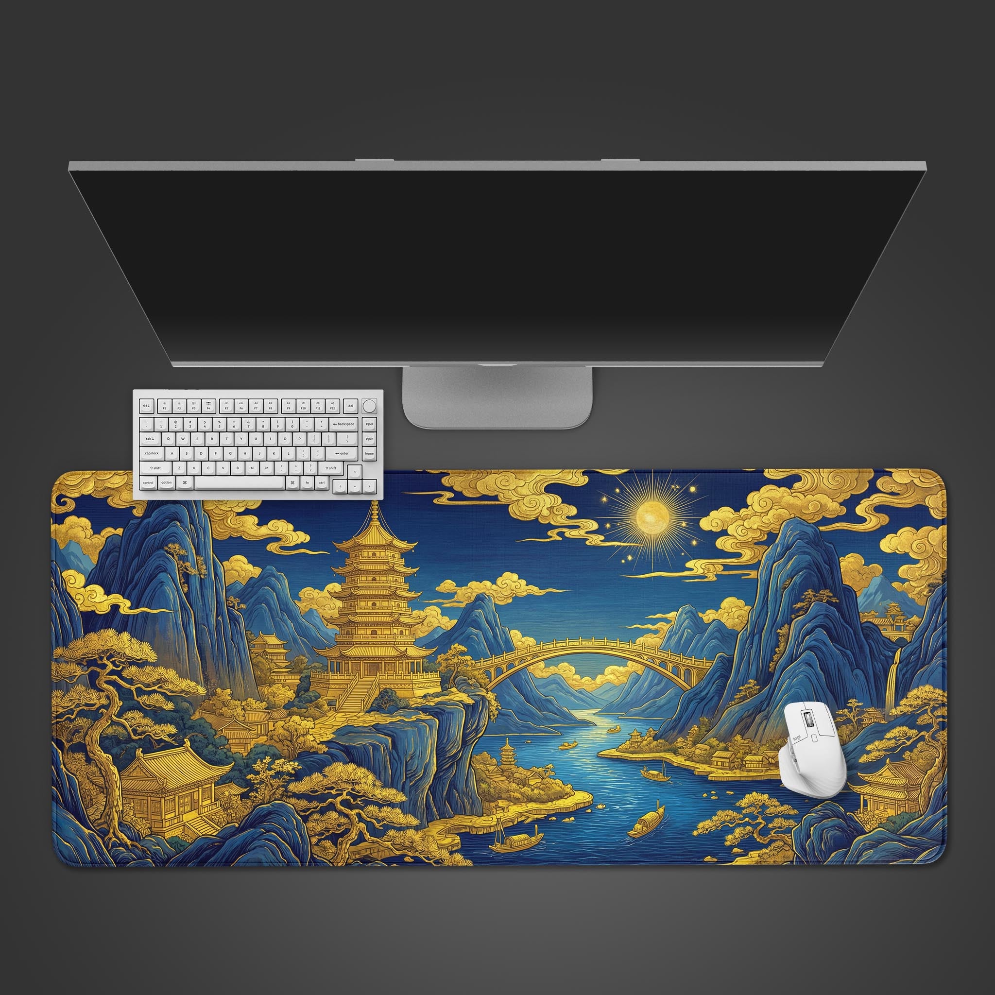 A top-down view of the Gilded Dynasty gaming desk mat, featuring a traditional Chinese landscape, displayed with a white keyboard and mouse under a monitor. - Epic Design Pads & Mousepads