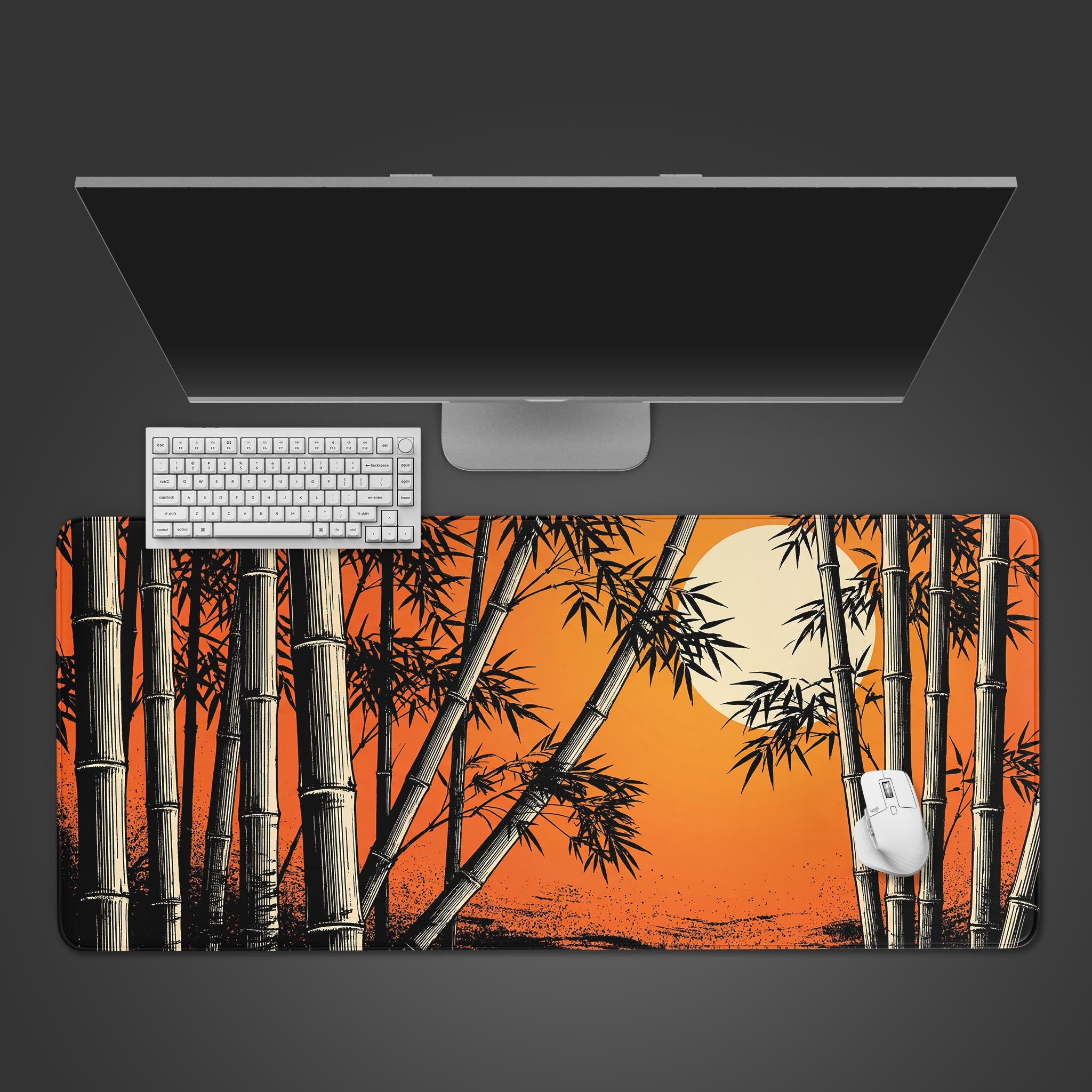 Top-down view of the Golden Bamboo gaming desk mat with its Japanese art design, laid out with a white keyboard, mouse, and a large monitor on a dark surface. - Epic Design Pads & Mousepads