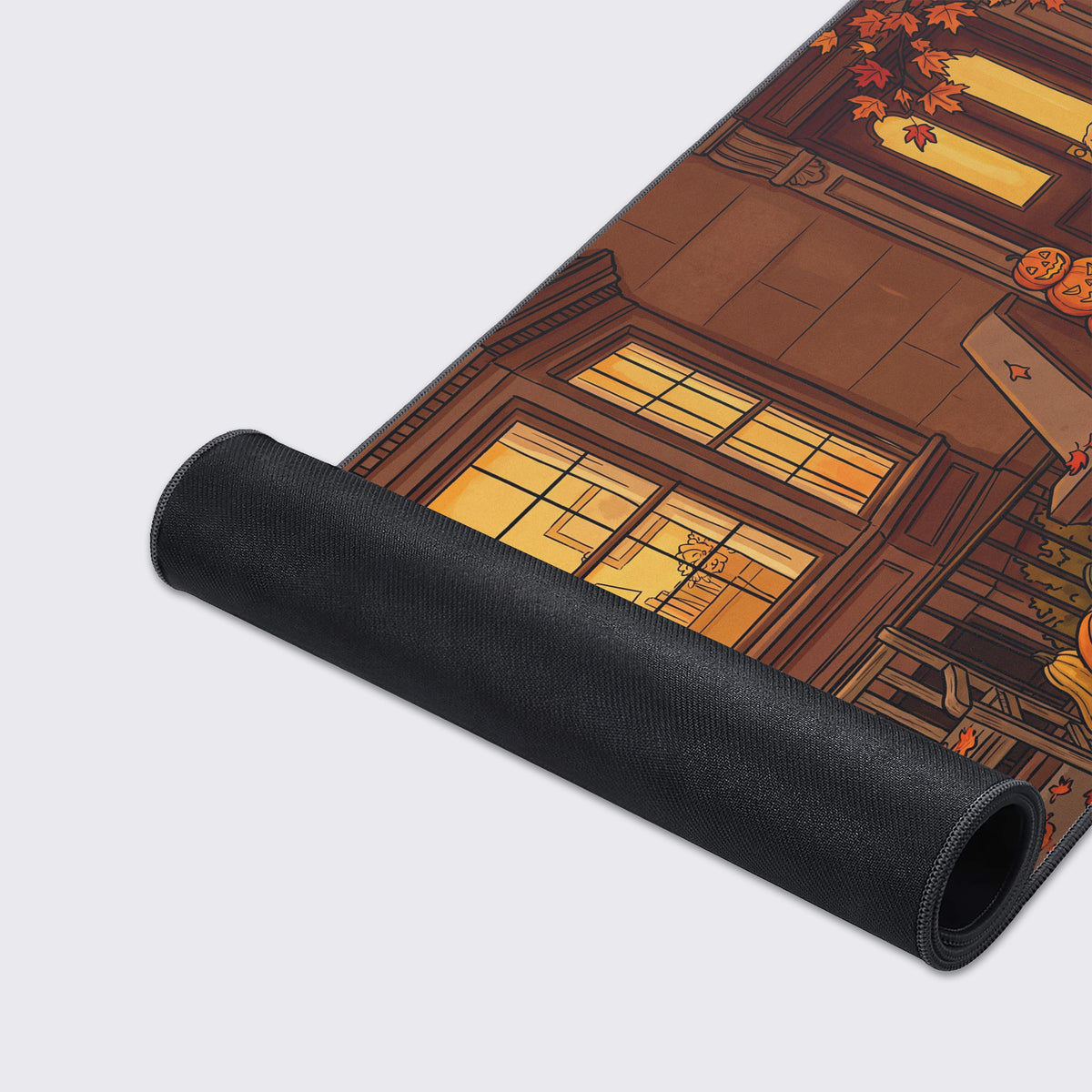 Detail view of the Golden Retriever dog and stacked jack-o'-lanterns on the front steps in the desk mat design.