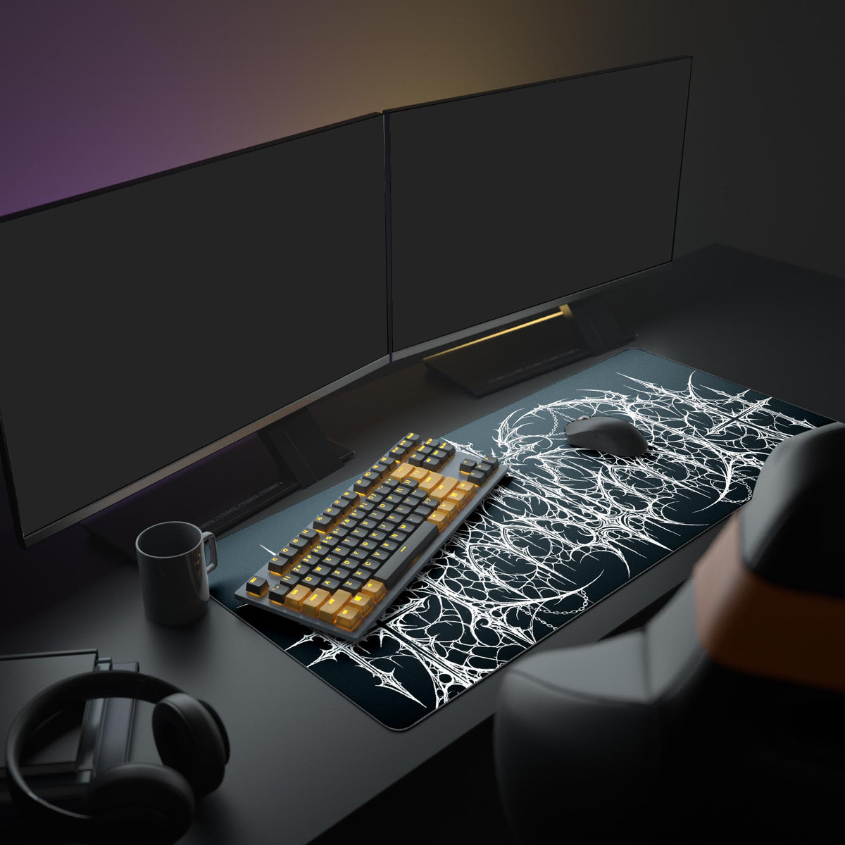 The Gothic Mainframe gaming desk mat shown in a dark PC setup, its intricate white design creating a stark contrast under a monitor and next to a gaming keyboard and mouse. - Epic Design Pads & Mousepads
