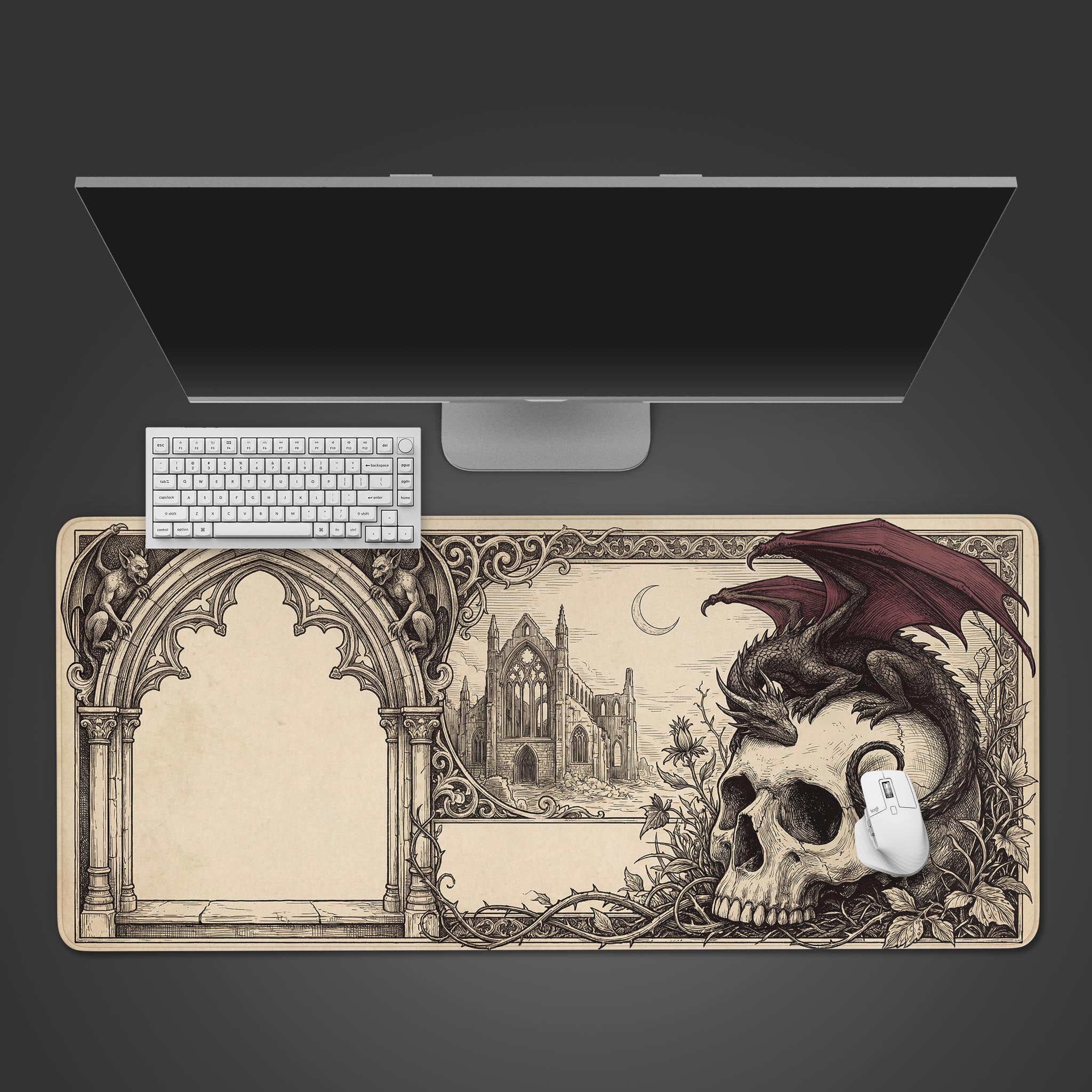 A top-down view of the Gothic Remnant Gaming Desk Mat, featuring a dragon and skull design, with a white keyboard and mouse on a dark background. - Epic Design Pads & Mousepads