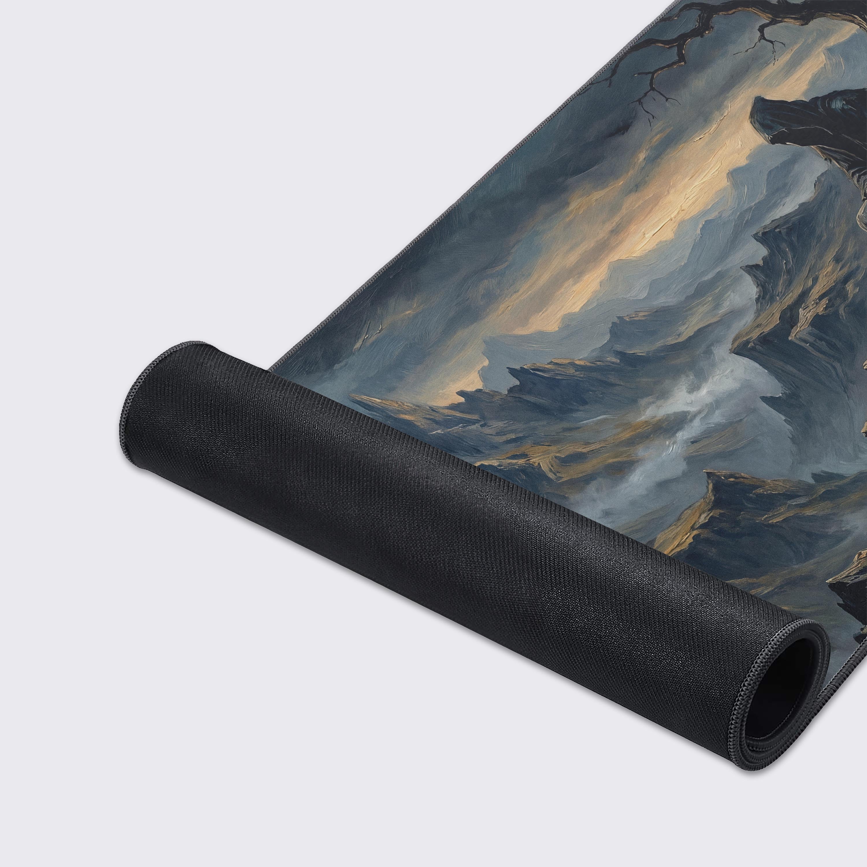 Detailed view of the jagged mountain peaks and glowing sunset on the desk mat.