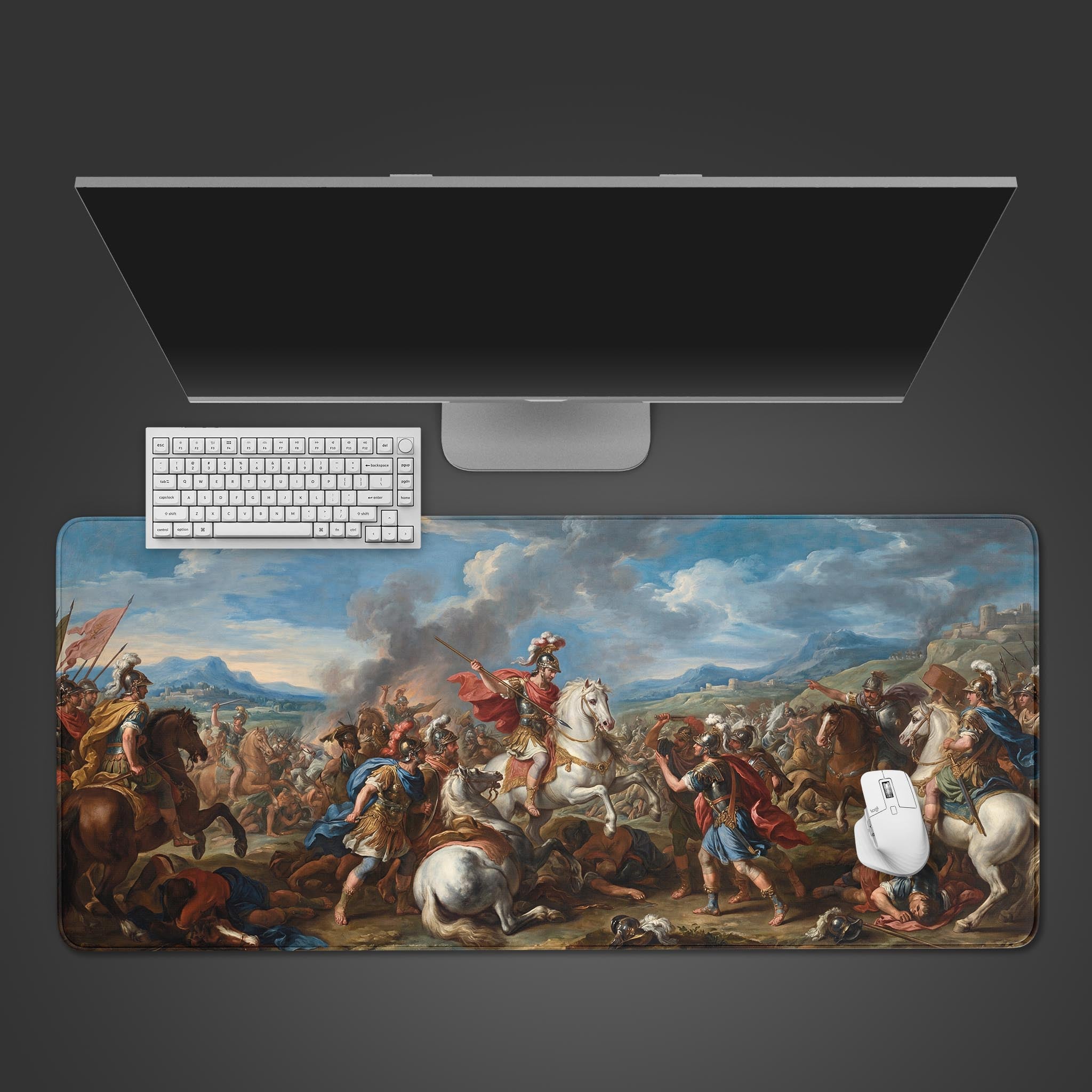 The 'Imperial Charge' gaming desk mat, showcasing a classical battle scene, is displayed on a desk with a white keyboard, mouse, and a large monitor. - Epic Design Pads & Mousepads