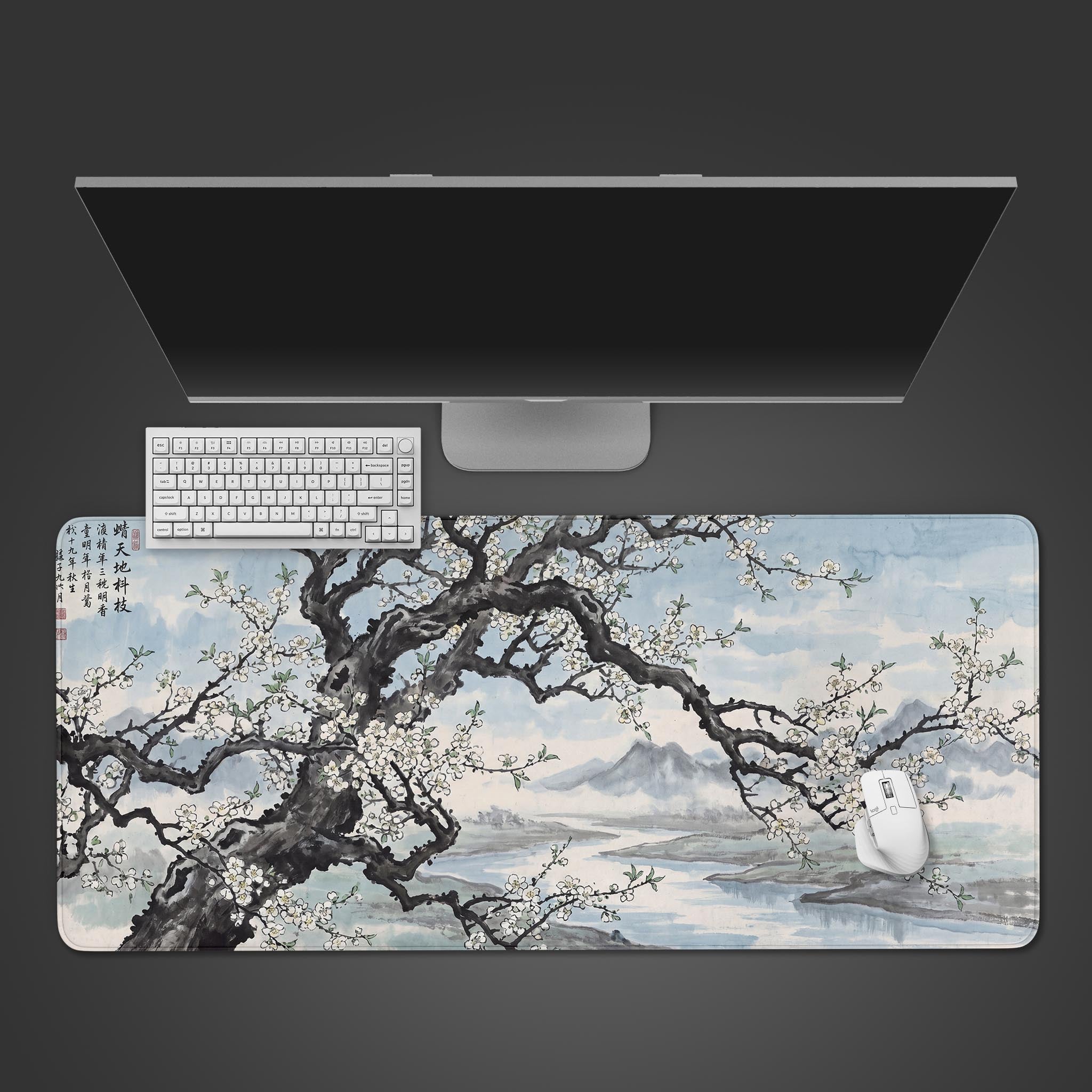 Traditional Chinese ink wash painting of a blooming tree over a river desk mat