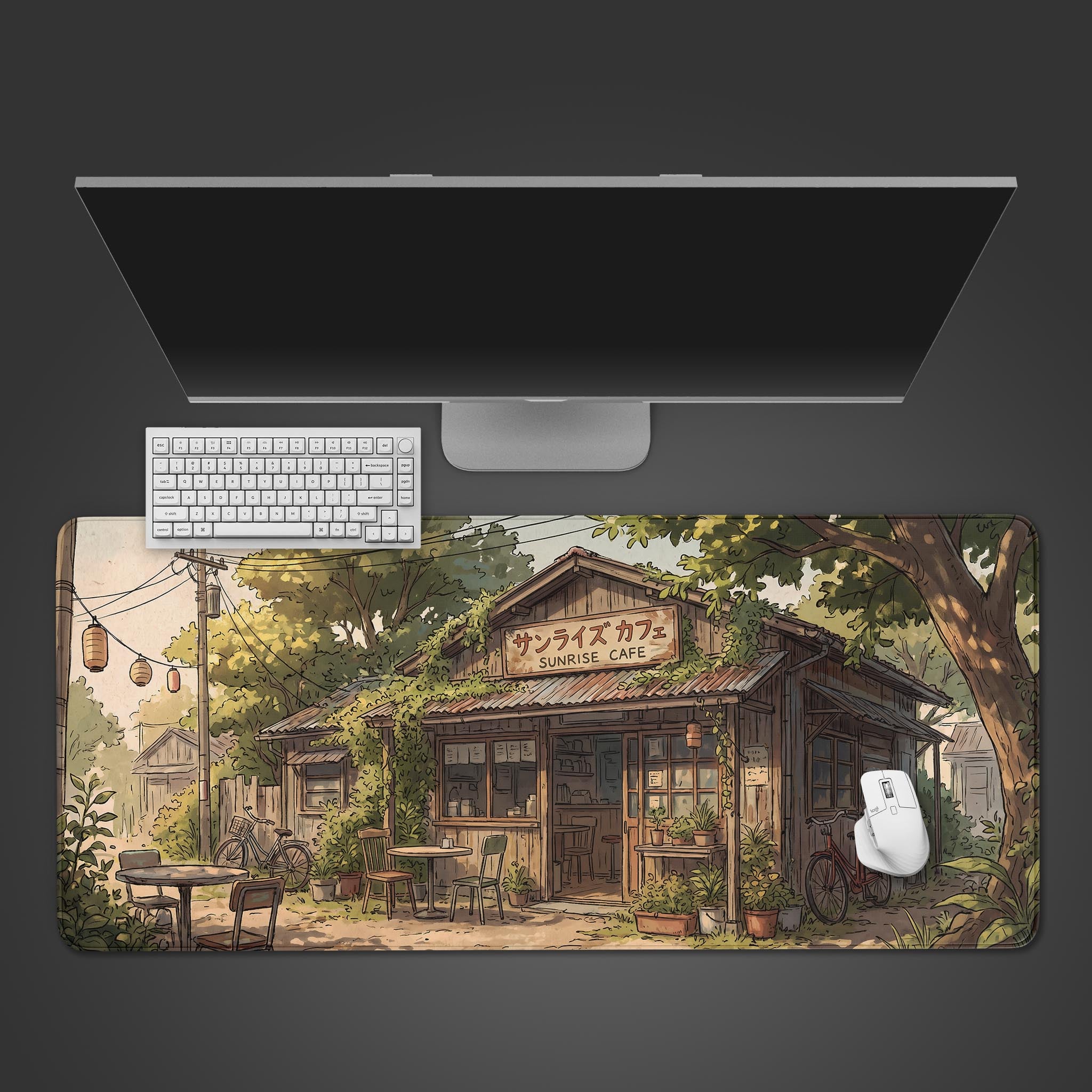 A desk mat featuring a cozy, anime-style Japanese cafe called Sunrise Cafe surrounded by lush greenery and bicycles.
