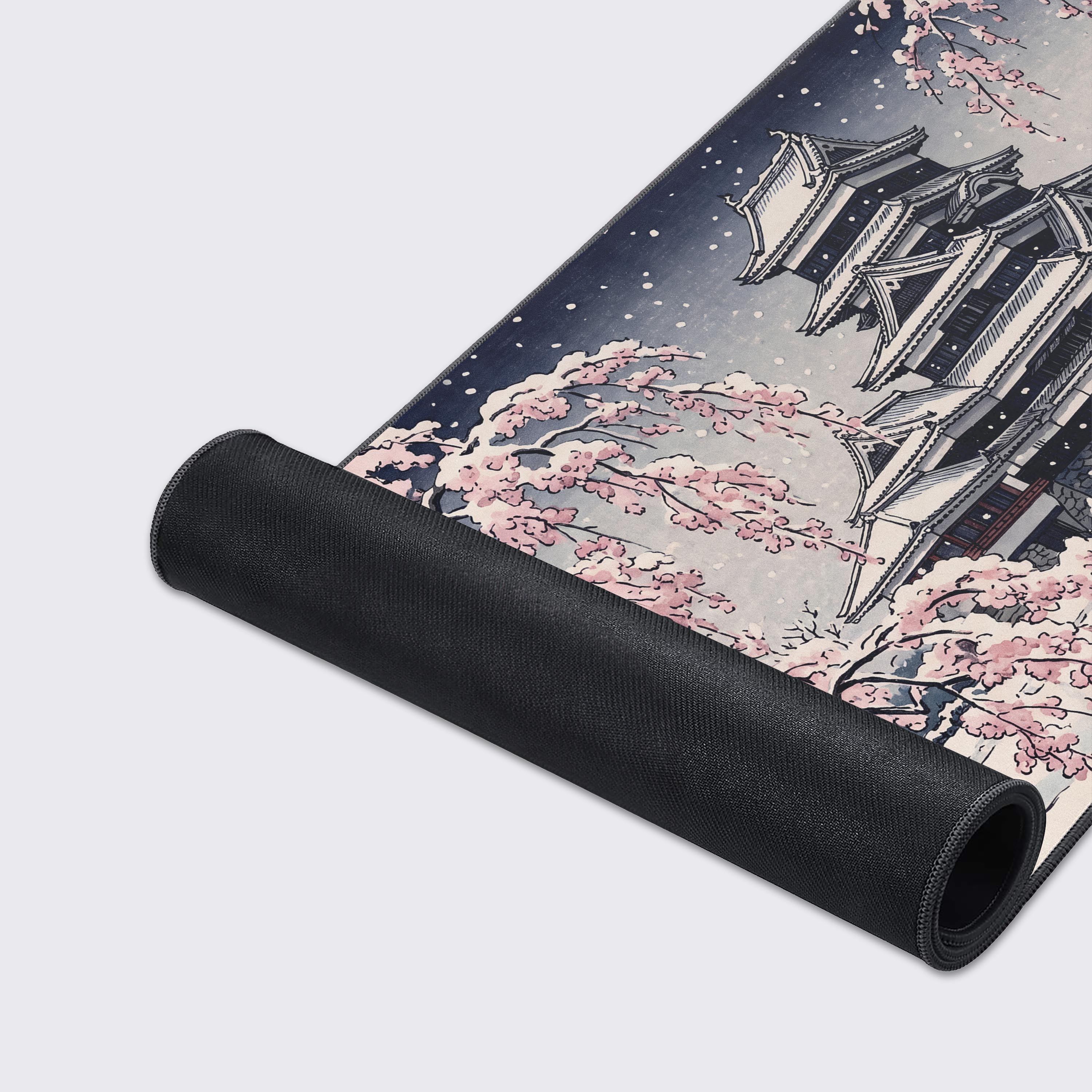 Detail view of the delicate pink cherry blossom branches heavily laden with winter snow.