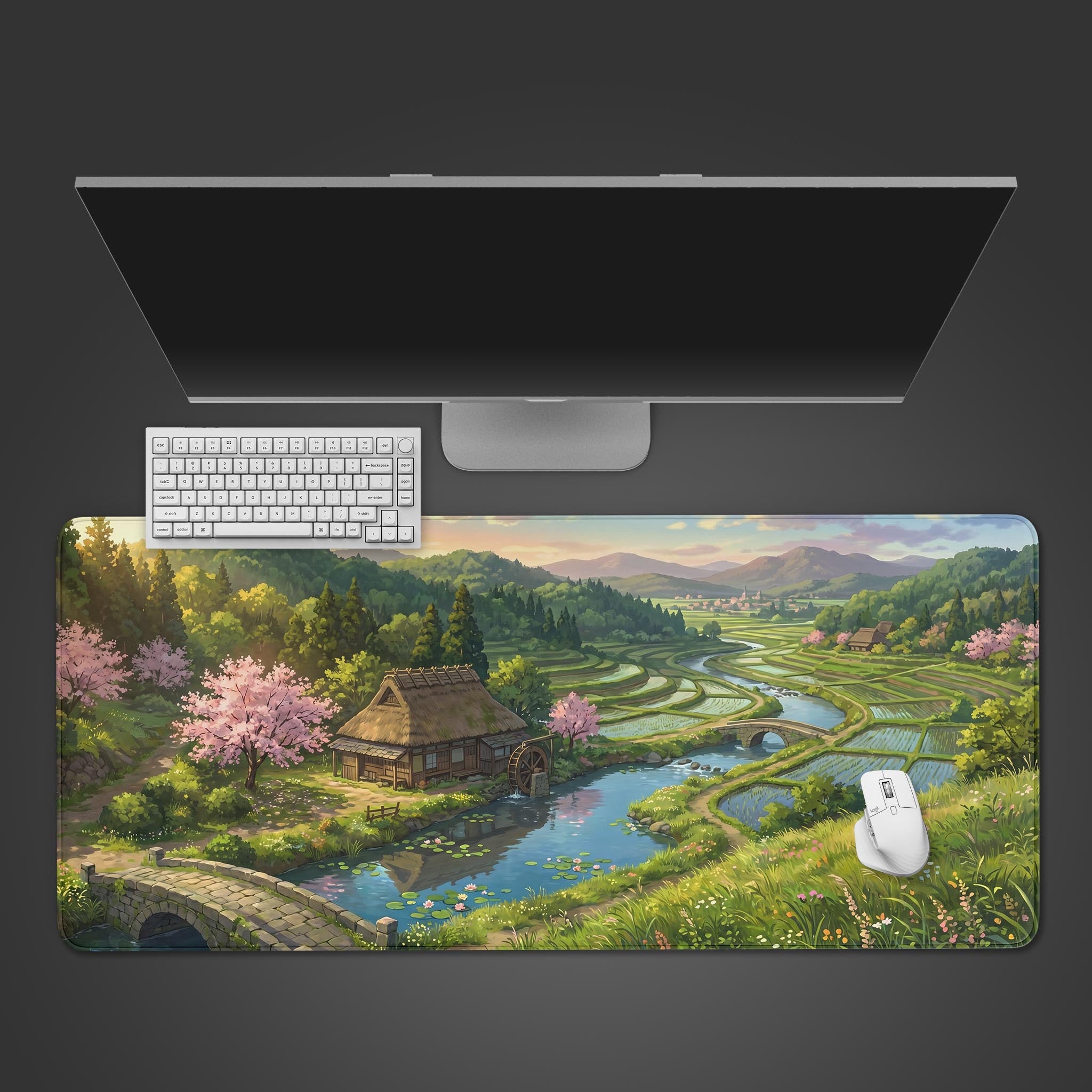 A serene Japanese countryside desk mat featuring terraced rice paddies, blooming cherry blossoms, and a rustic water mill.