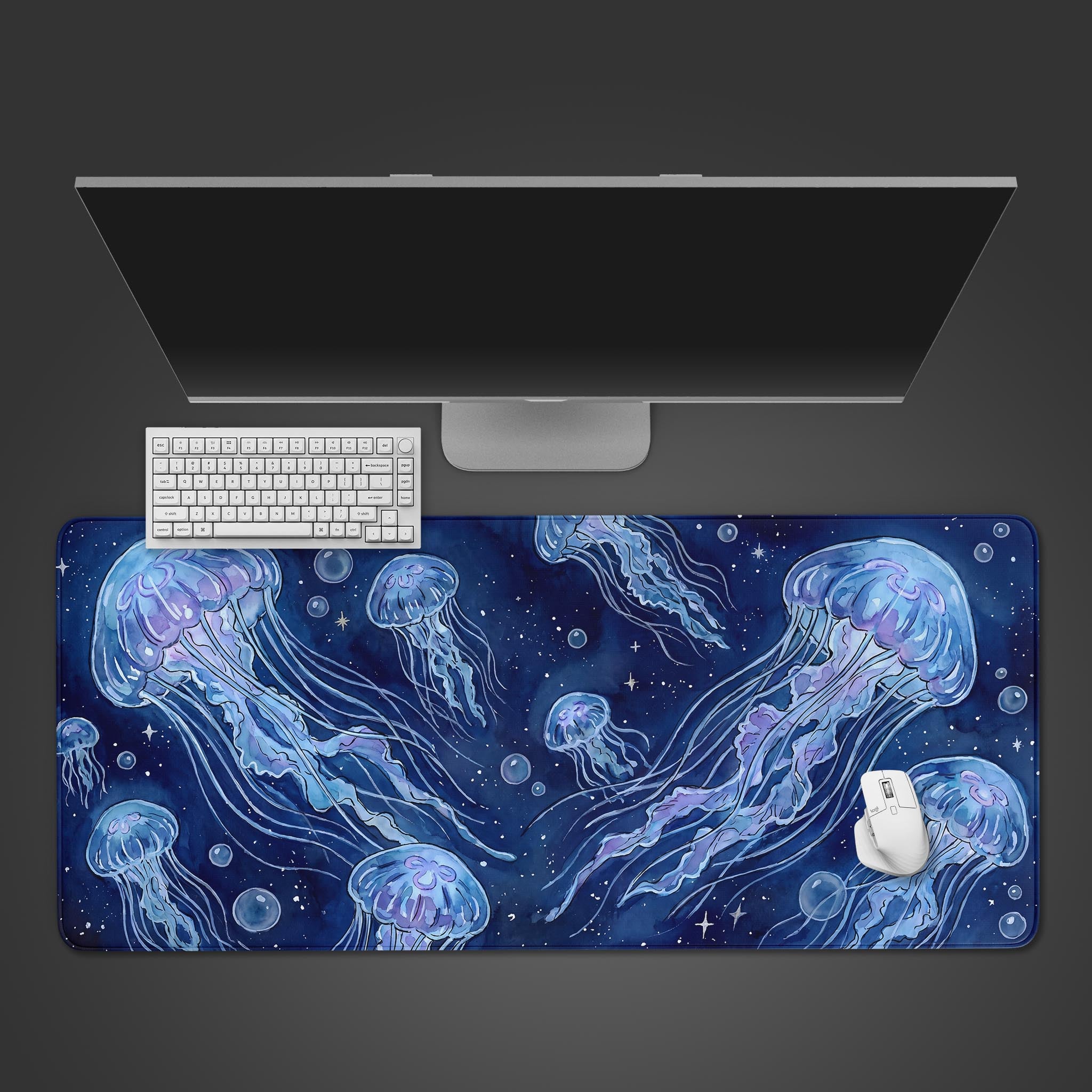 Celestial Jellyfish watercolor desk mat featuring glowing blue medusas floating in a starry ocean background