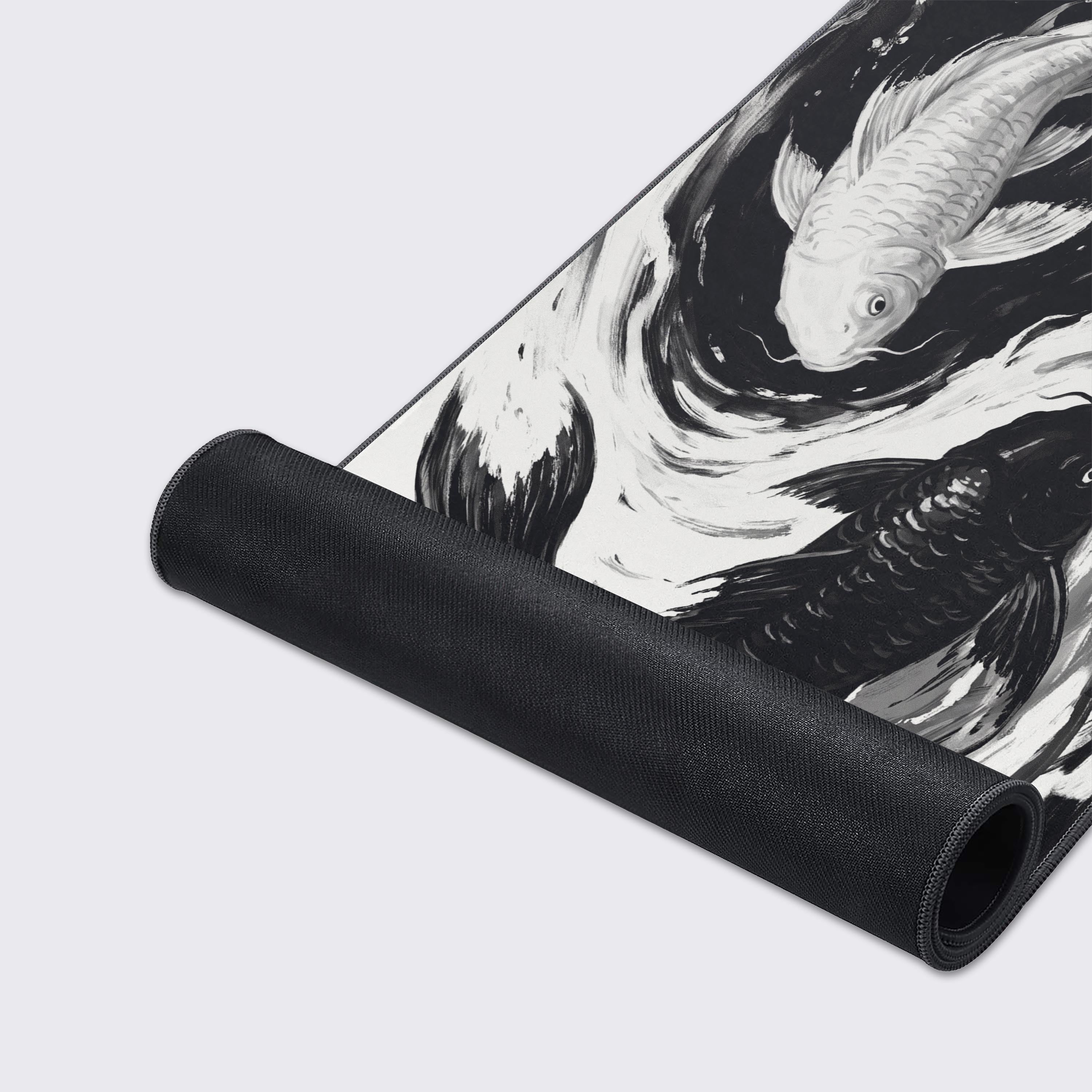 Monochrome fluid art desk pad featuring two koi fish in a dynamic water vortex