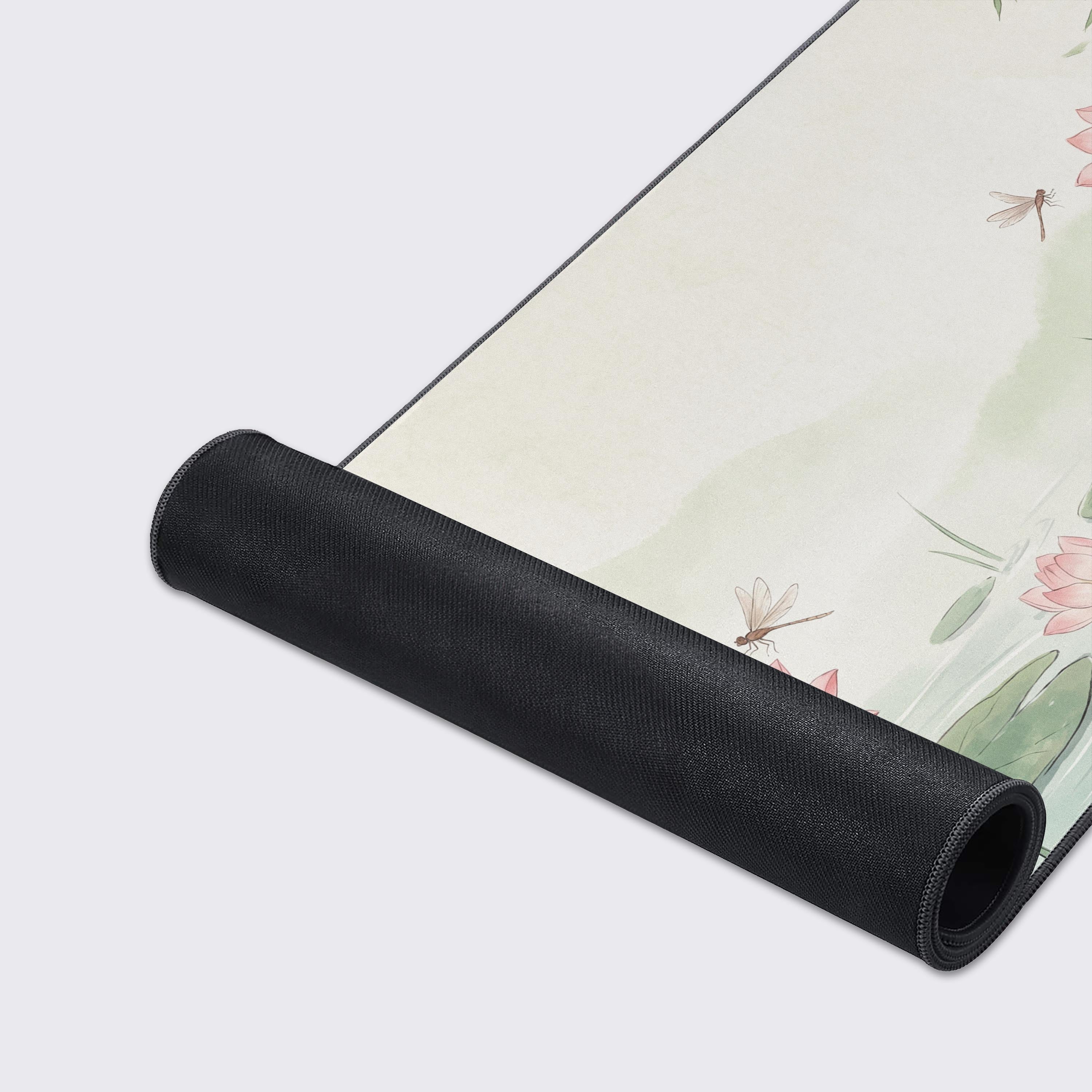 Serene botanical workspace setup with a pale green and pink lotus flower desk mat
