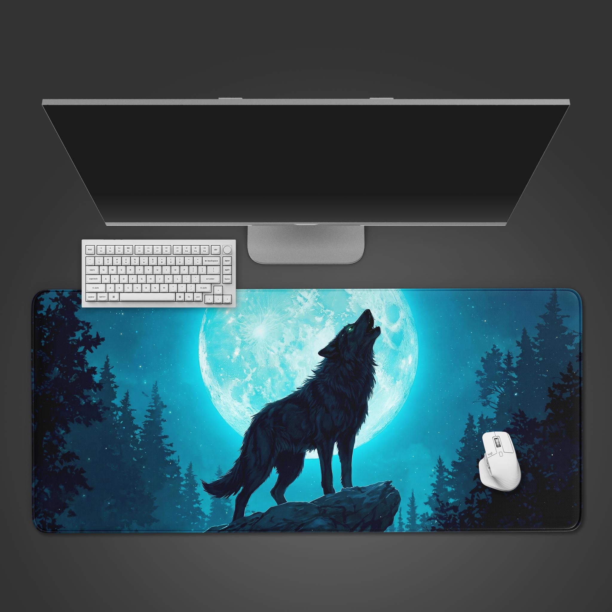 Lunar Call wolf desk mat with cyan moon design – top-down view on a desk with a keyboard and mouse. - Epic Design Pads & Mousepads