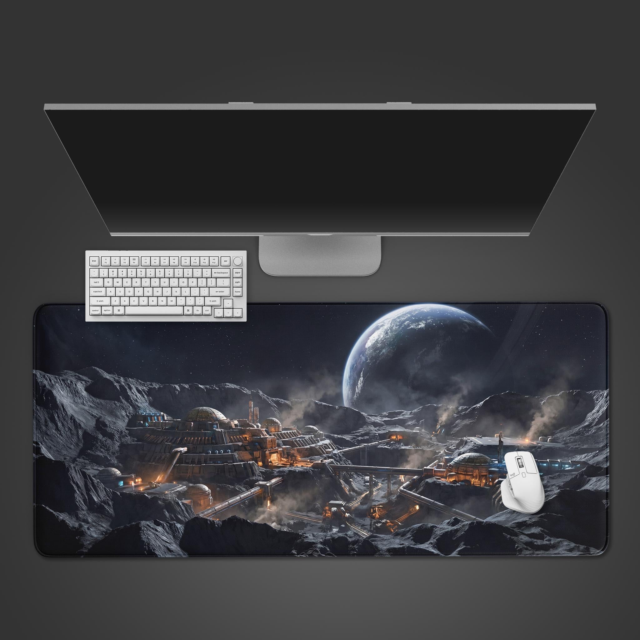 Top-down view of the Lunar Frontier gaming desk mat on a grey desk, shown with a white keyboard, mouse, and a large monitor. - Epic Design Pads & Mousepads
