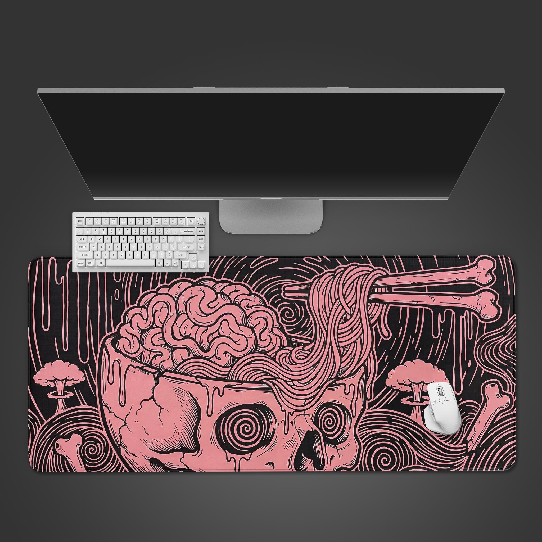 Top-down view of the Mind Melt gaming desk mat featuring a pink skull and ramen design, shown with a white keyboard, mouse, and monitor. - Epic Design Pads & Mousepads