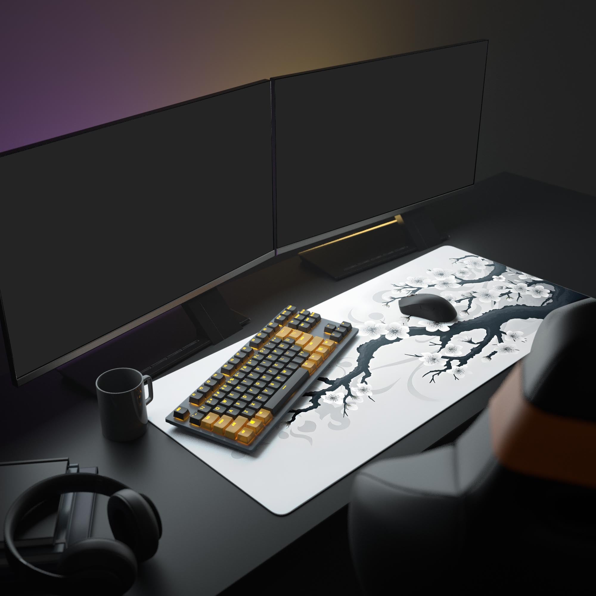 Modern desk setup with a keyboard, mouse, and large mouse pad in a dimly lit room.