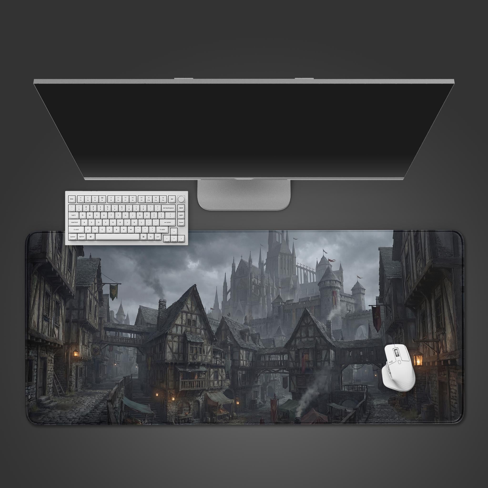 A top-down view of the Misty Borough gaming desk mat, showing the dark fantasy city design underneath a white keyboard and mouse. - Epic Design Pads & Mousepads