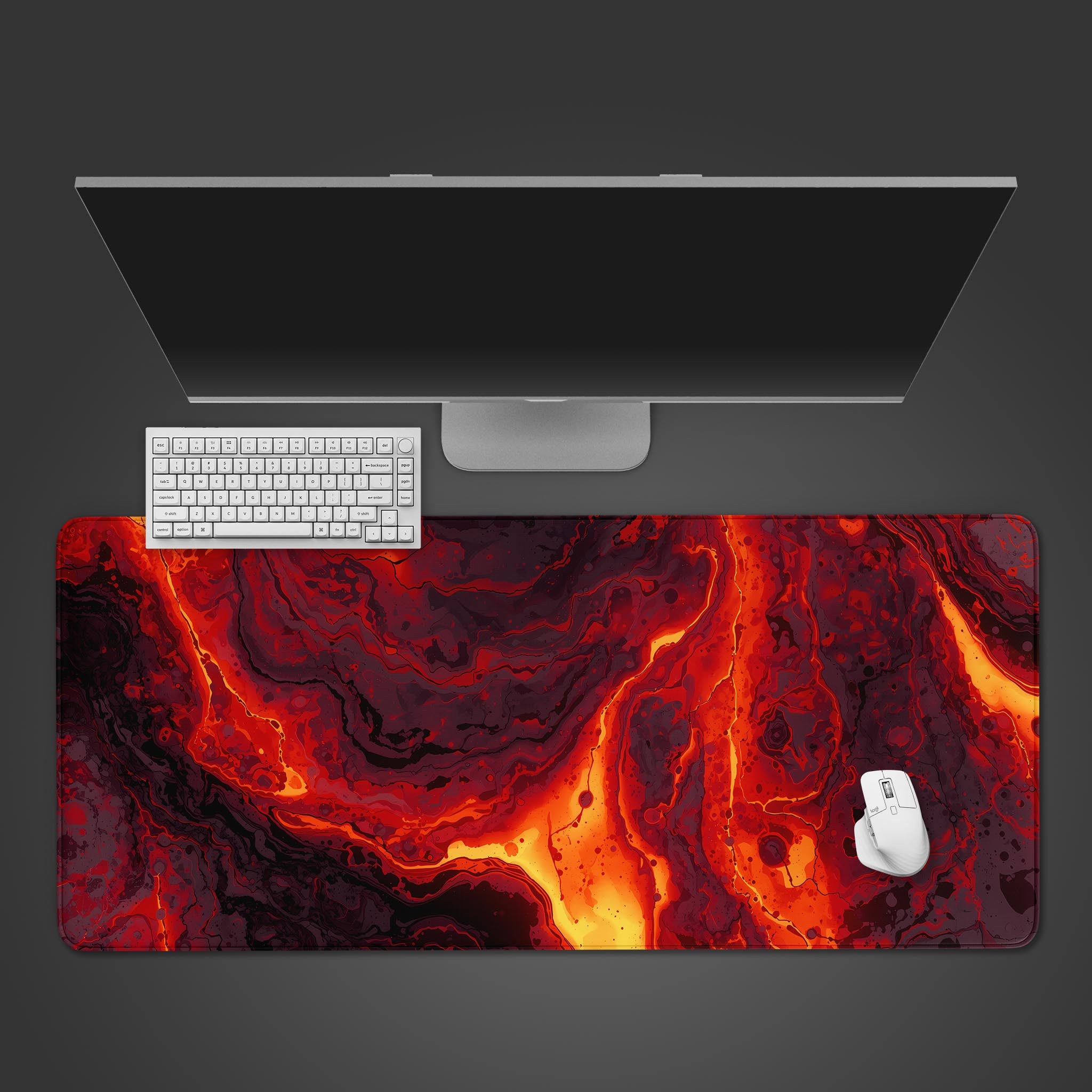 Molten Heart lava desk mat with fiery abstract design, shown in a desktop view with a black keyboard and mouse. - Epic Design Pads & Mousepads