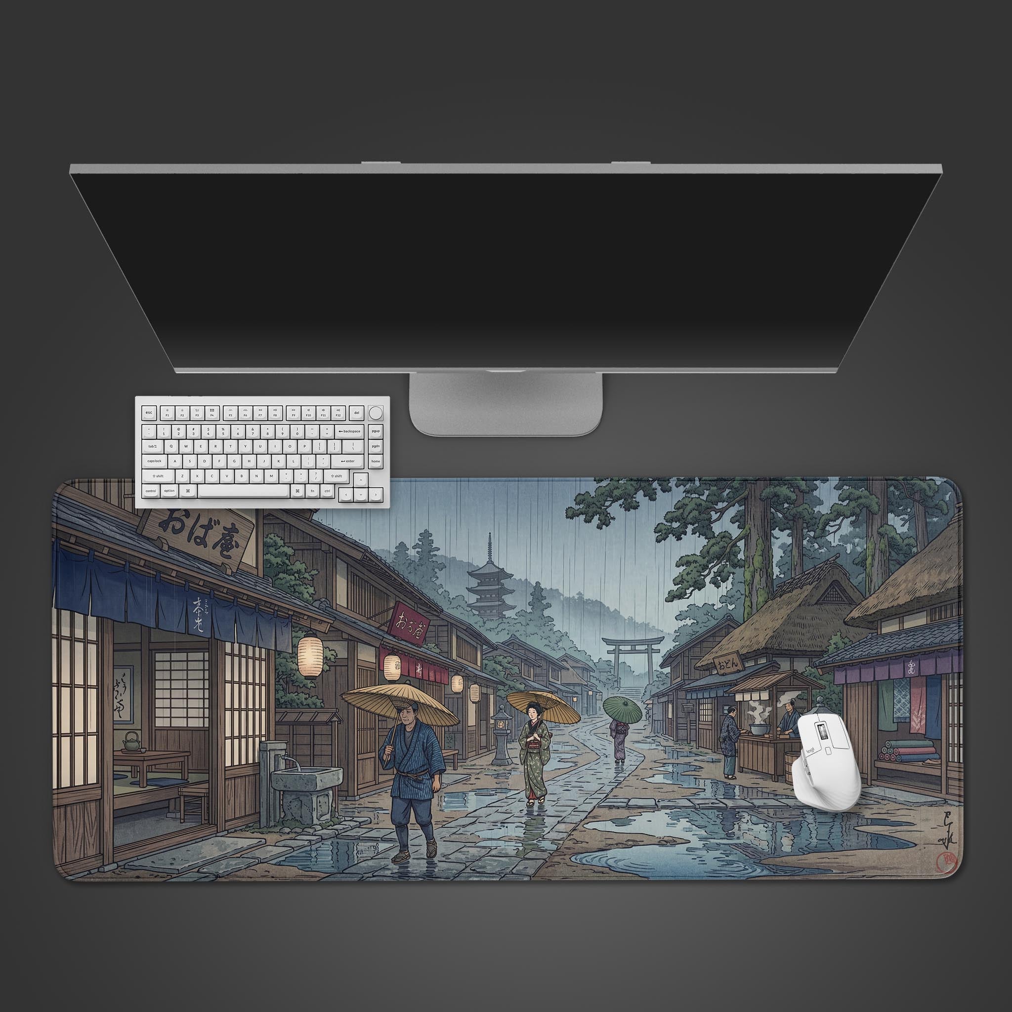 Top-down view of the Monsoon Kyoto gaming desk mat, featuring a rainy Japanese village scene, with a white keyboard and mouse on top. - Epic Design Pads & Mousepads