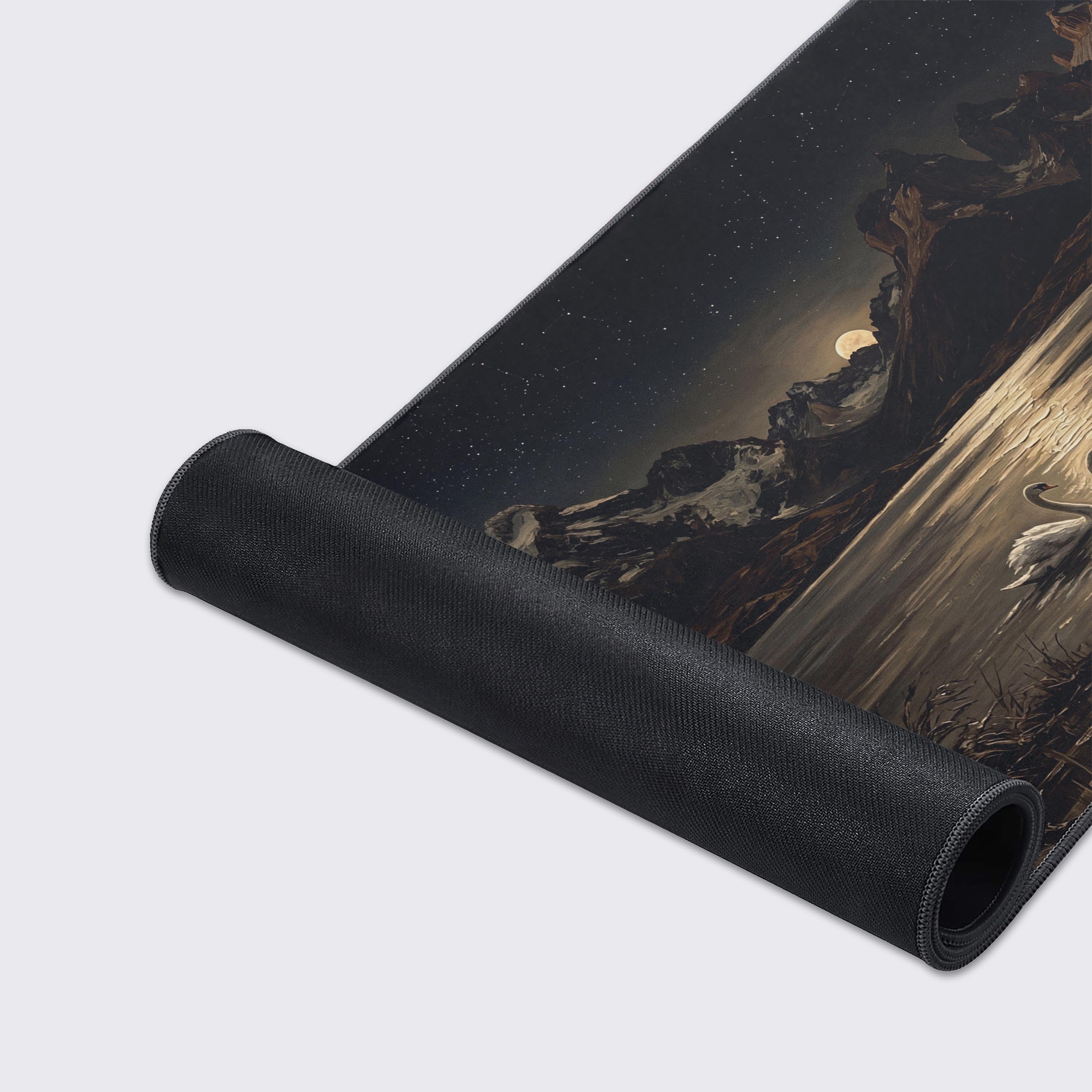 Detailed view of the majestic mountains and starry night sky on the gaming mouse pad