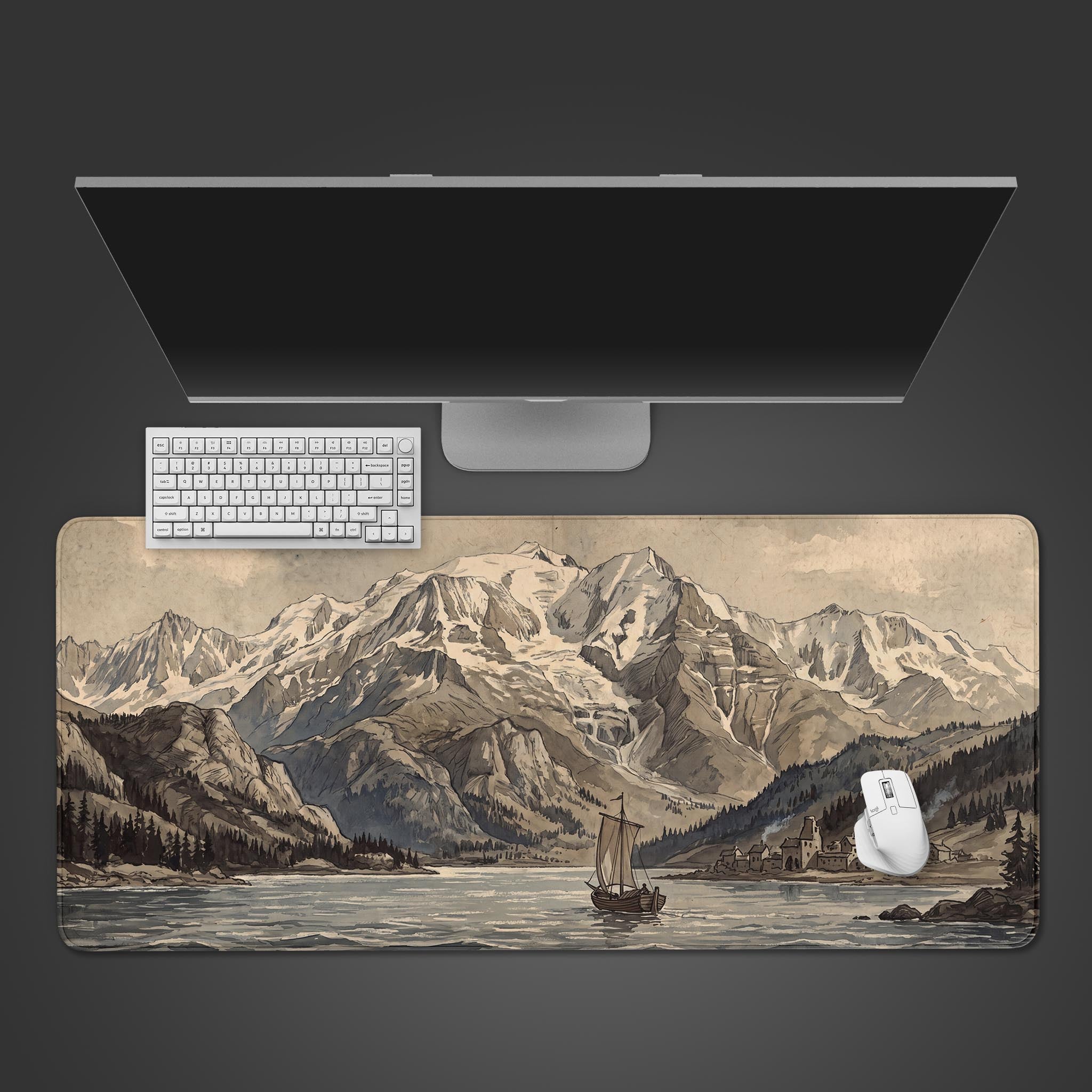 Desk mat displaying a vintage sepia-toned sketch of a majestic mountain range, a tranquil lake, and a small village.