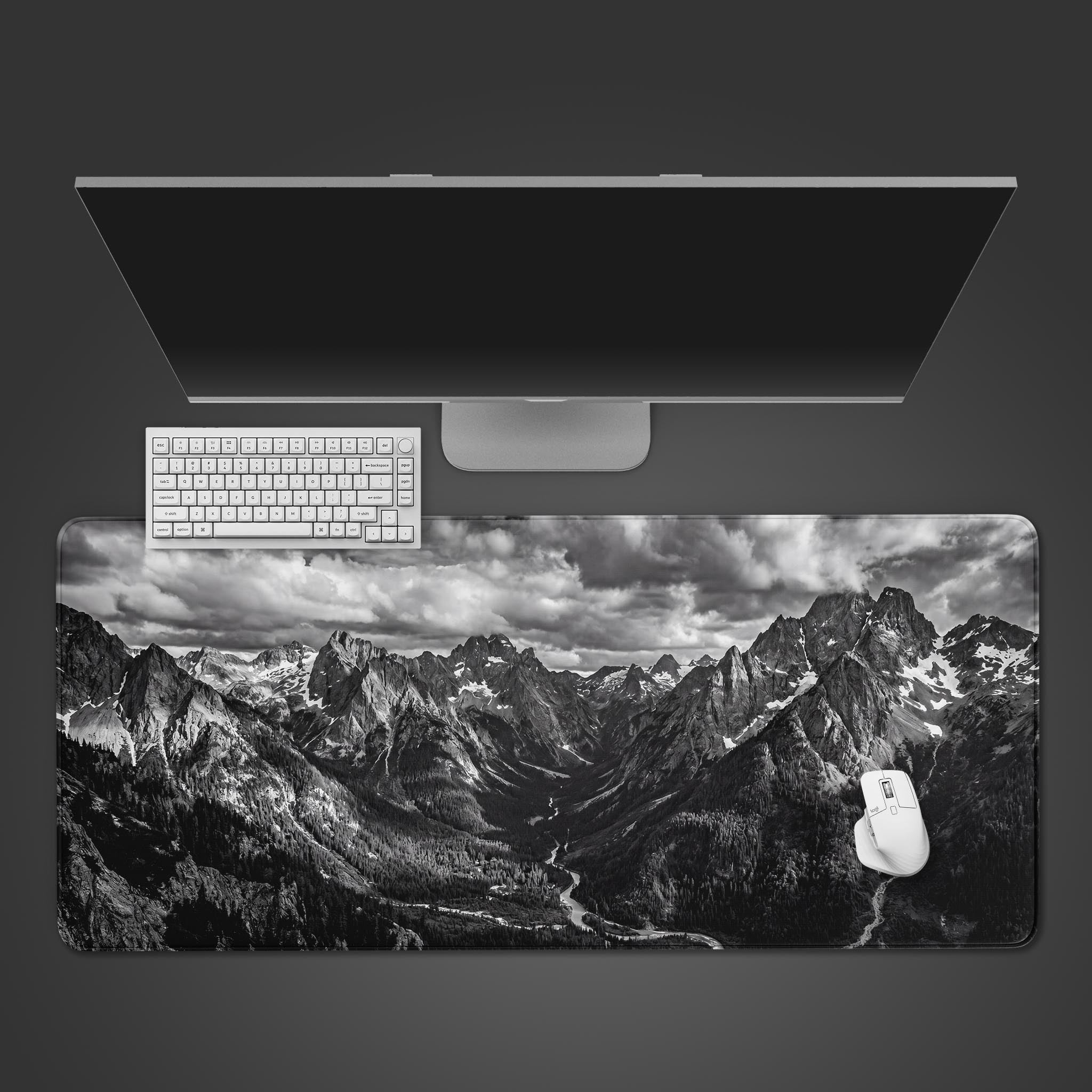 Monochrome Peaks black and white mountain landscape desk mat showcasing a dramatic alpine valley.