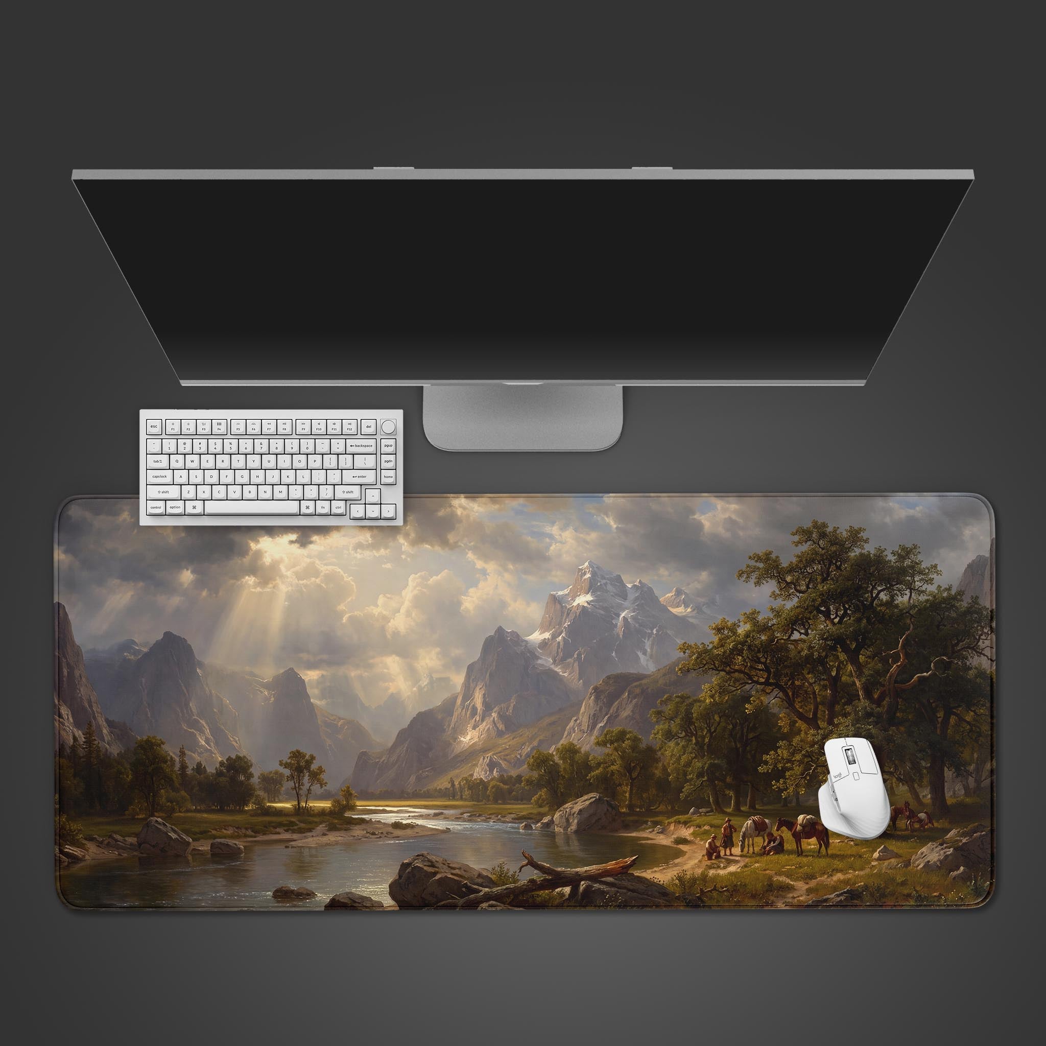 A desk mat featuring a vast classical landscape with towering mountains, a winding river, and travelers resting on the bank.