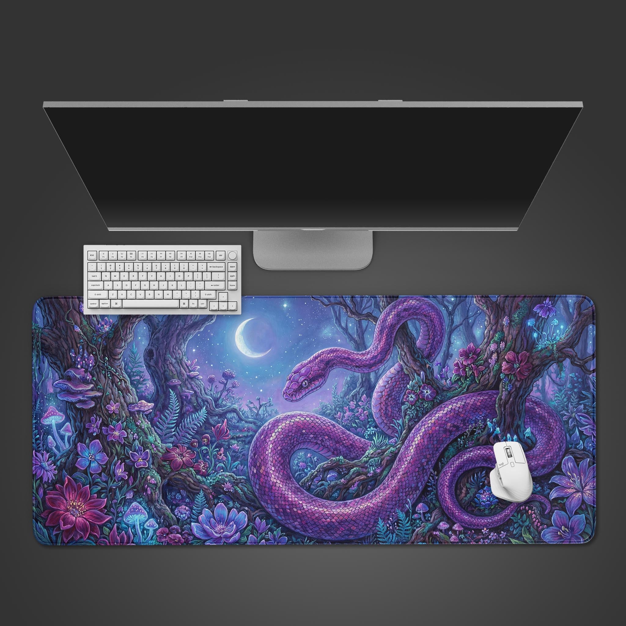A top-down view of the Mystic Serpent gaming desk mat, featuring a large purple snake in a forest, shown with a white keyboard and mouse on a dark background. - Epic Design Pads & Mousepads