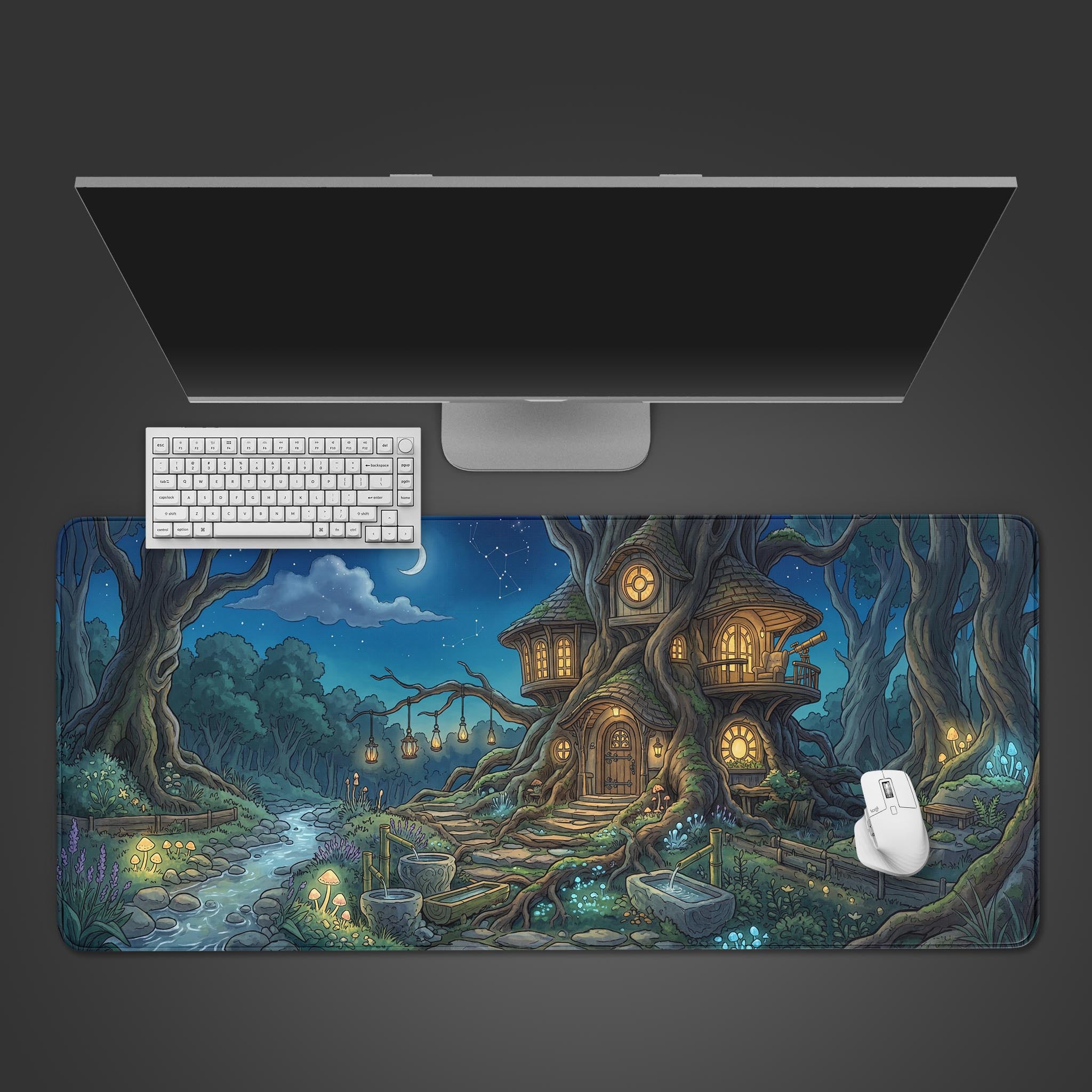 The Mystic Treehouse gaming desk mat shown from a top-down view, featuring a white keyboard and mouse placed on the enchanting nocturnal forest artwork. - Epic Design Pads & Mousepads