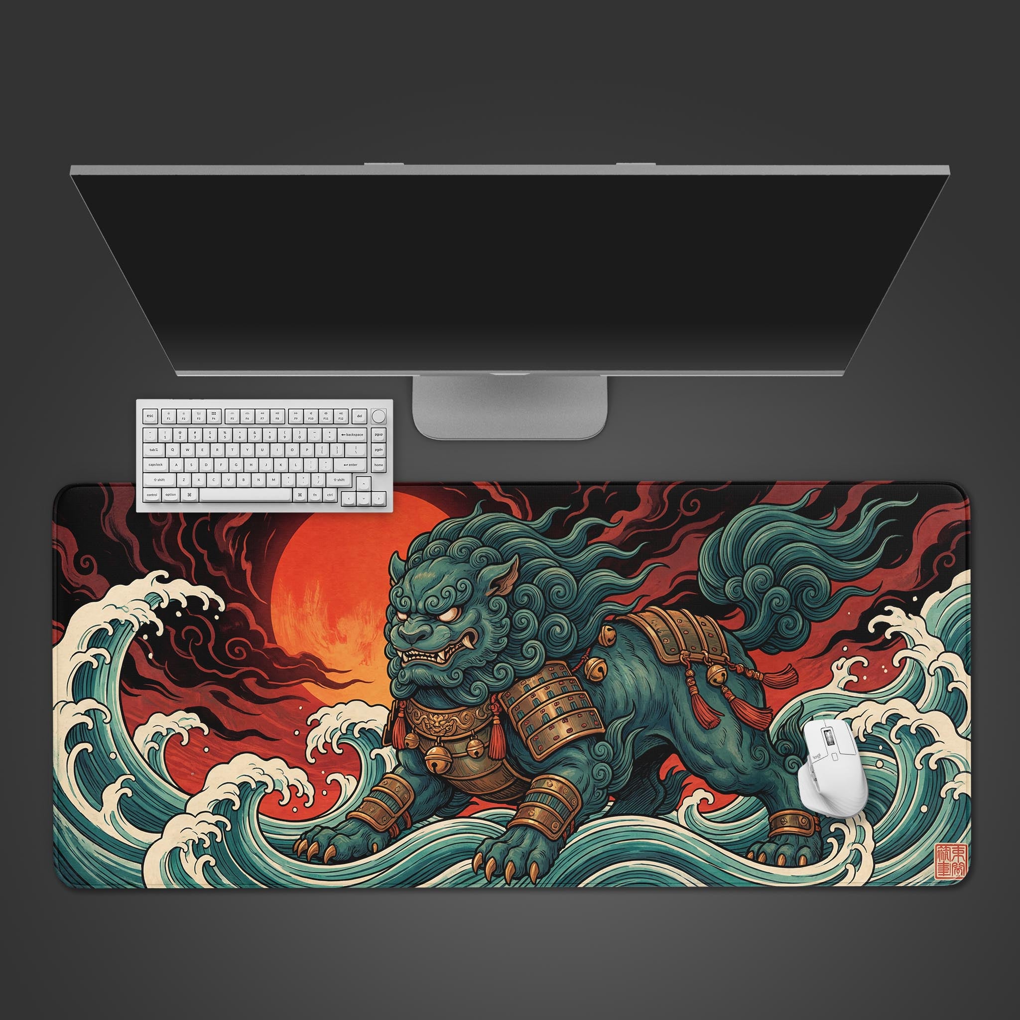 A top-down view of the Mythic Komainu gaming desk mat, showing the Japanese Ukiyo-e design with a white keyboard and mouse placed on it under a large monitor. - Epic Design Pads & Mousepads