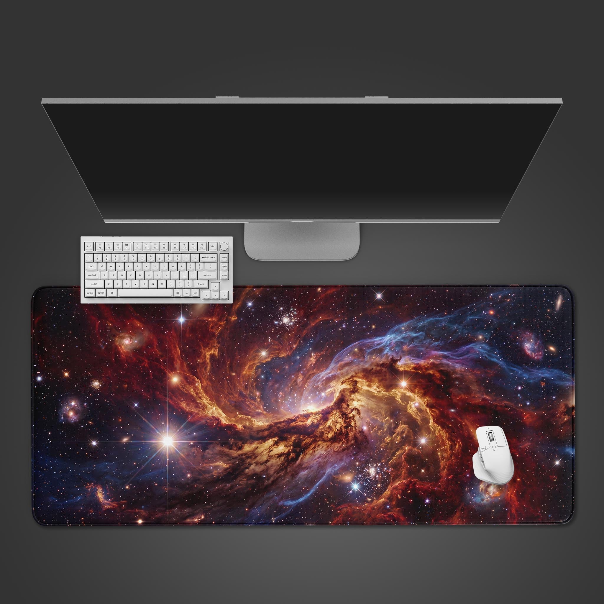 Vibrant Nebula desk mat featuring a swirling deep space galaxy in rich reds, oranges, and blues.
