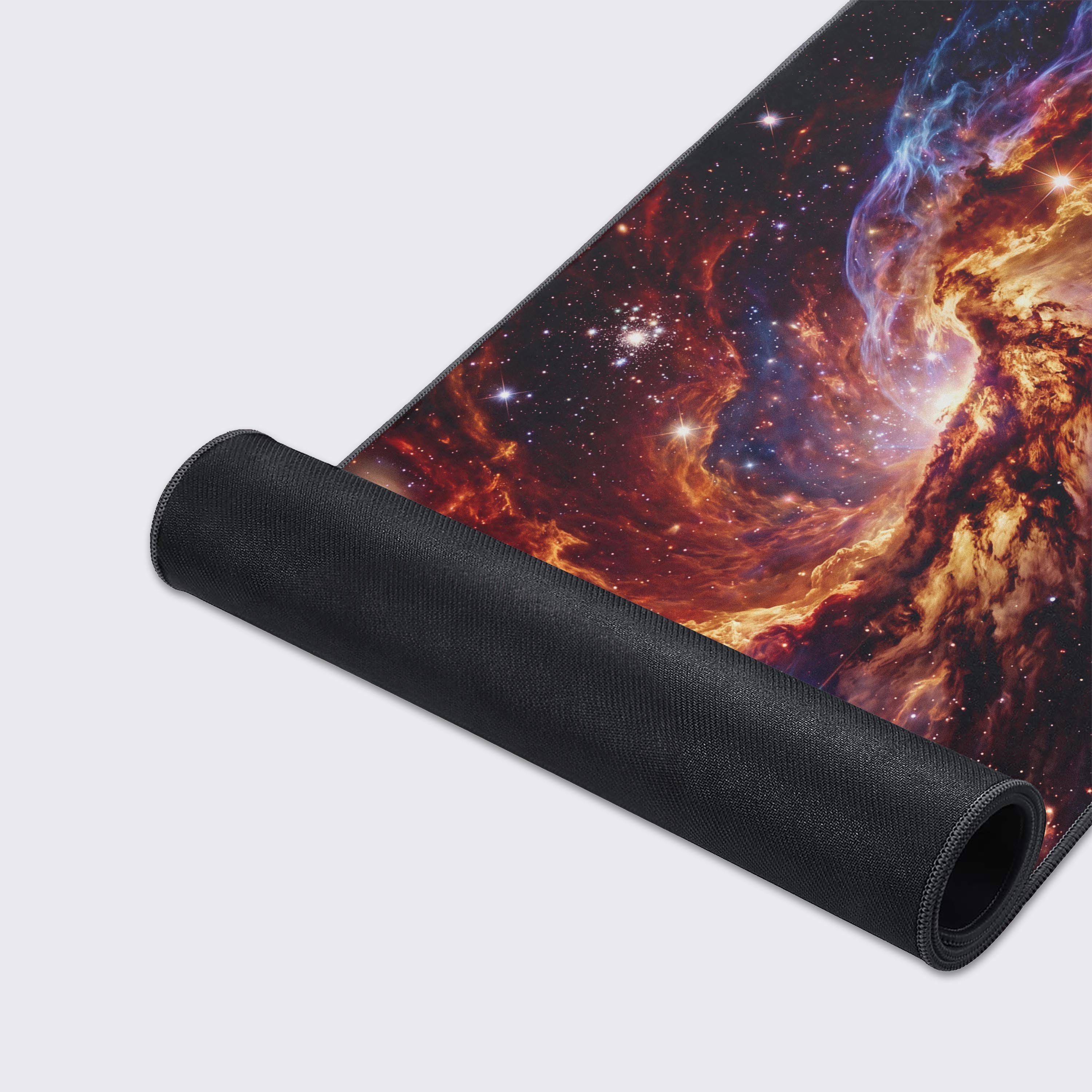 Epic design pads cosmic nebula desk mat highlighting the super smooth surface and edge stitching.
