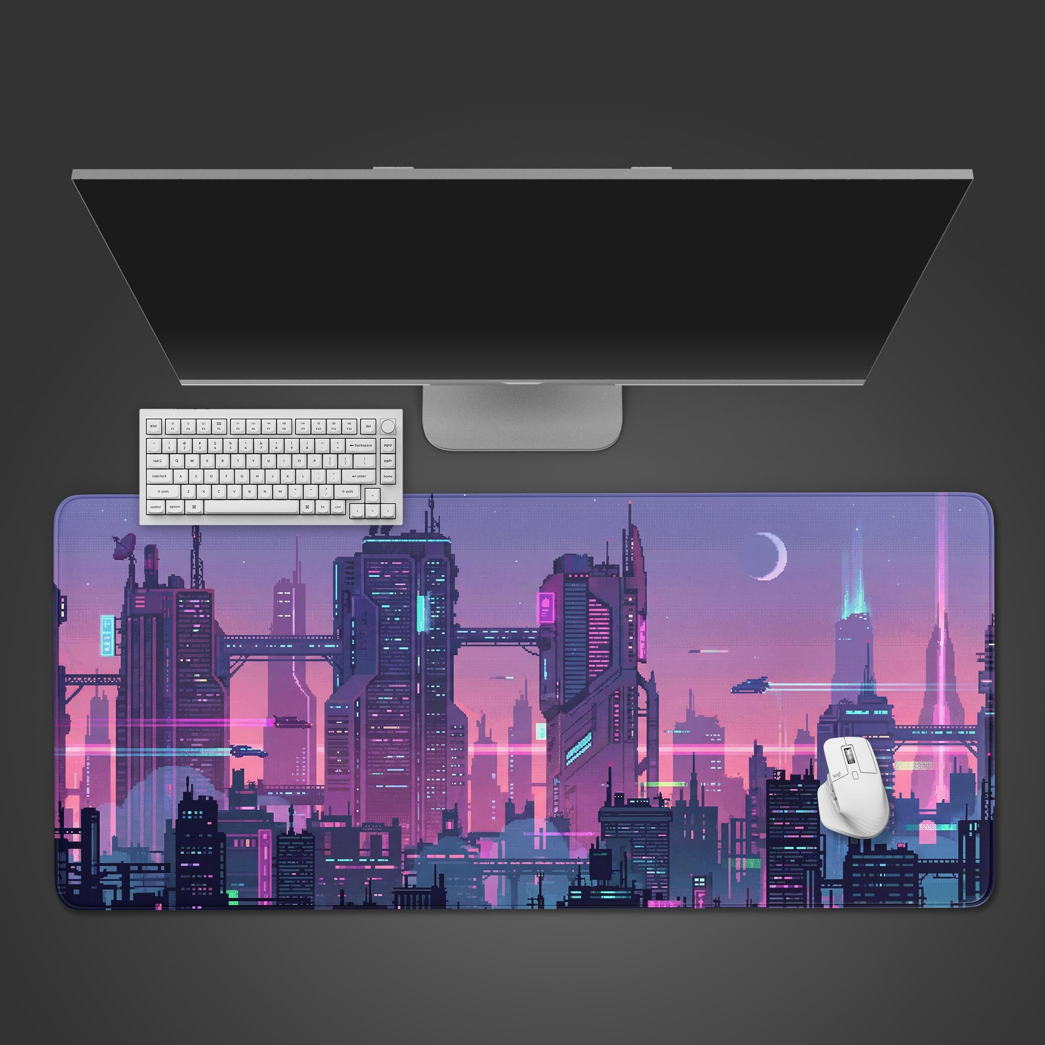 Top-down view of the Neon Bitscape Gaming Desk Mat featuring a purple pixel art city, shown with a white keyboard, mouse, and monitor on a dark background. - Epic Design Pads & Mousepads
