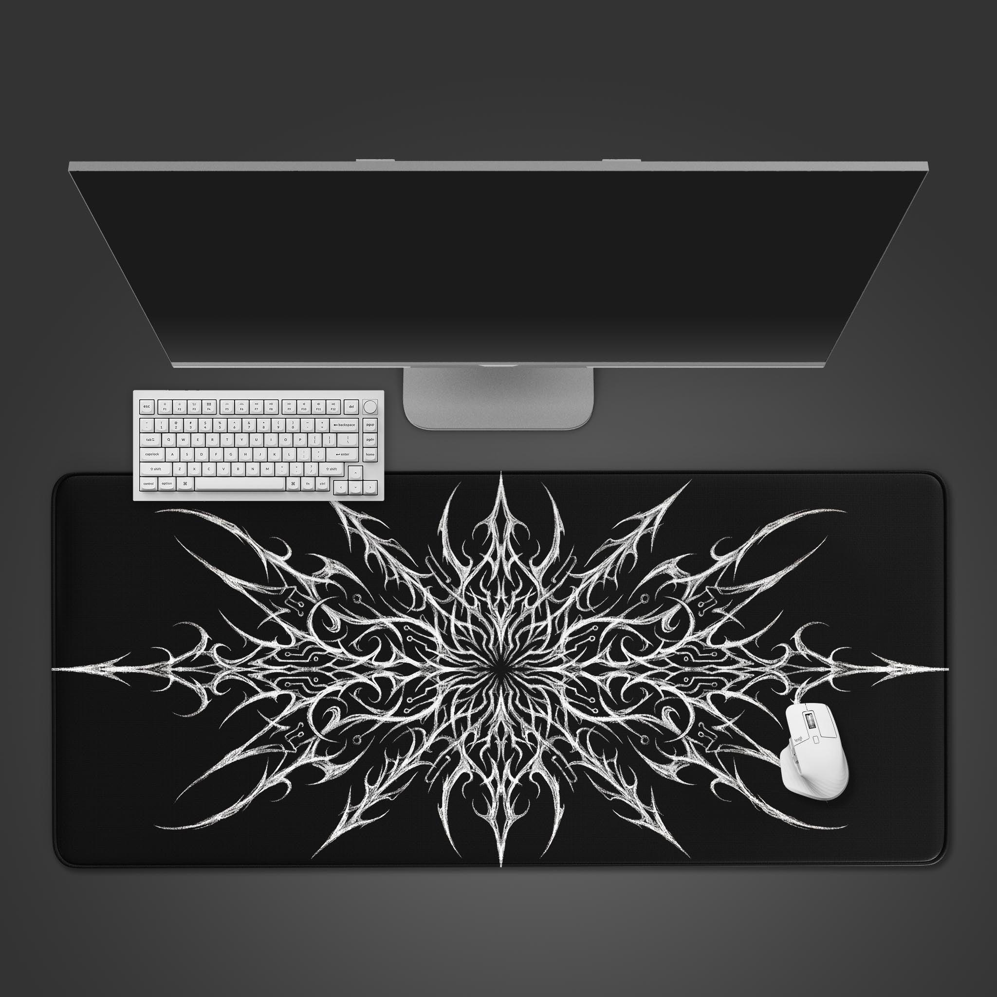 Top-down view of the Neural Thorn gaming desk mat, featuring a white abstract design on black, with a minimalist white keyboard and mouse. - Epic Design Pads & Mousepads