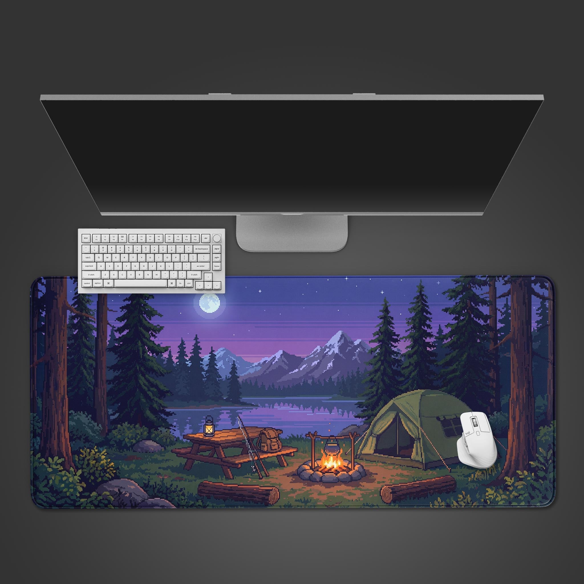 Top-down view of the Nightfall Camp gaming desk mat, displaying a pixel art campsite scene with a white keyboard and mouse on a dark background. - Epic Design Pads & Mousepads
