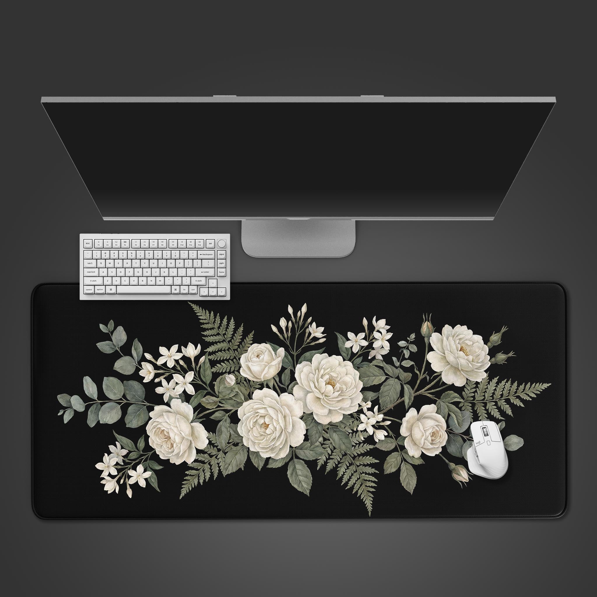 Top-down view of the Obsidian Bloom floral gaming desk mat with a white keyboard and mouse, showcasing the elegant white rose design on a black background. - Epic Design Pads & Mousepads