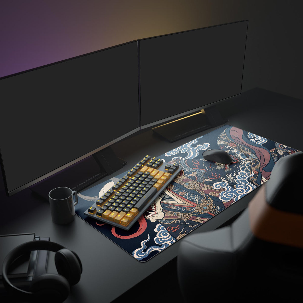 Desk mat with a horned skull in dragon kimono amid blue clouds under two monitors, with keyboard, mouse, mug and headphones