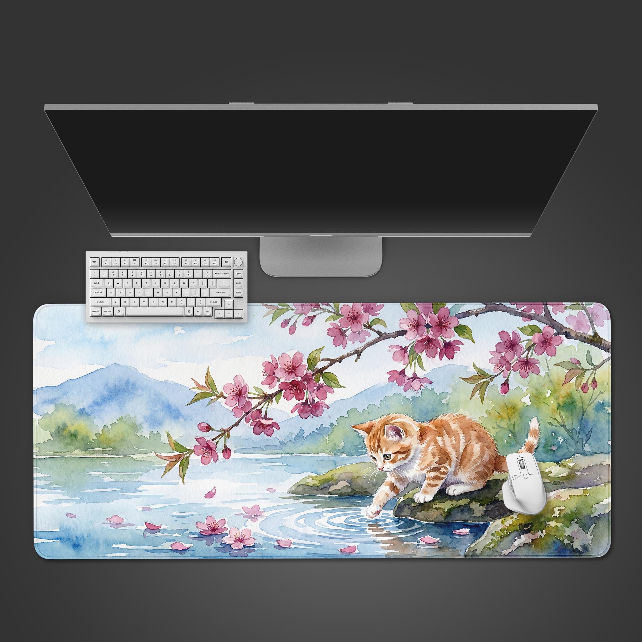 Watercolor orange kitten touching water under cherry blossoms on a large desk mat