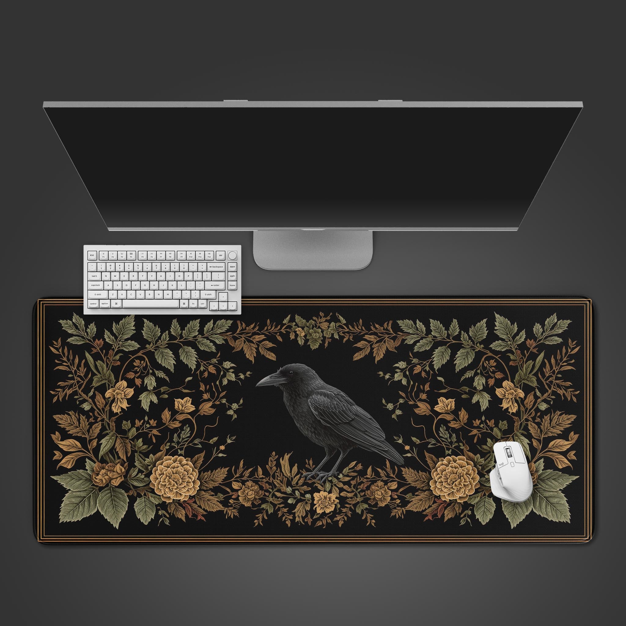 Ornate Raven desk mat with gothic floral border shown from a top-down view with a black keyboard and mouse. - Epic Design Pads & Mousepads