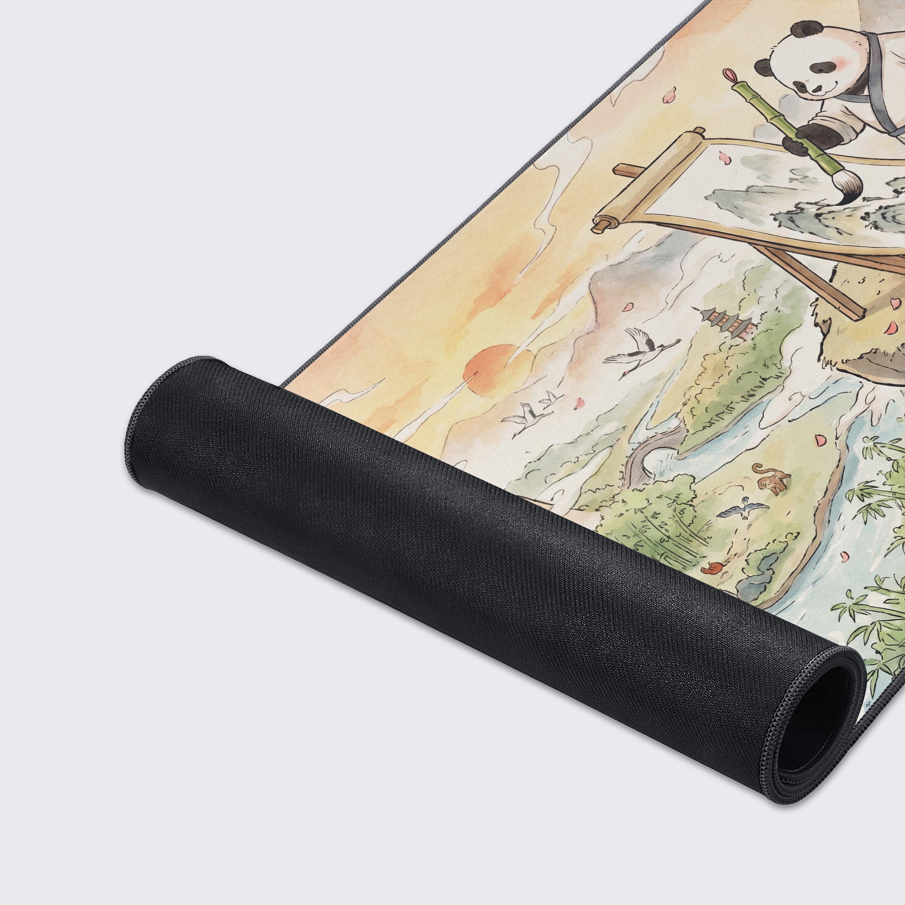 Top-down view of the Panda Masterpiece gaming mouse pad illustrating vibrant nature scenes, rivers, and cranes.