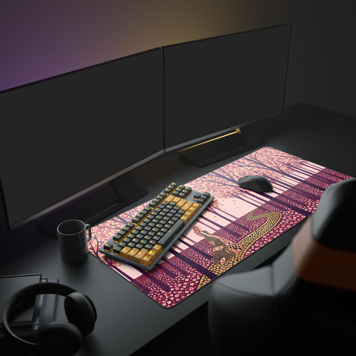 Desk mat on a dark desk under two monitors with a black and gold keyboard, mouse and mug; pink orchard with gold path