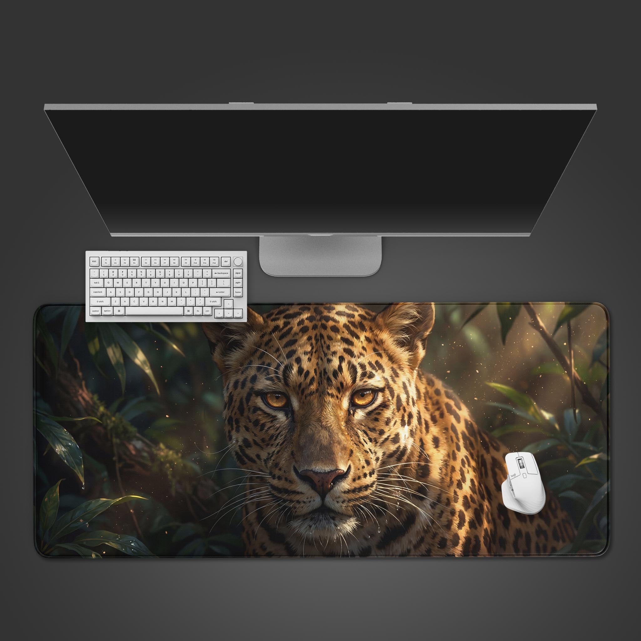 The Primal Ambush Spirit Gaming Desk Mat shown from a top-down view with a white keyboard and mouse, highlighting the intense leopard face design. - Epic Design Pads & Mousepads