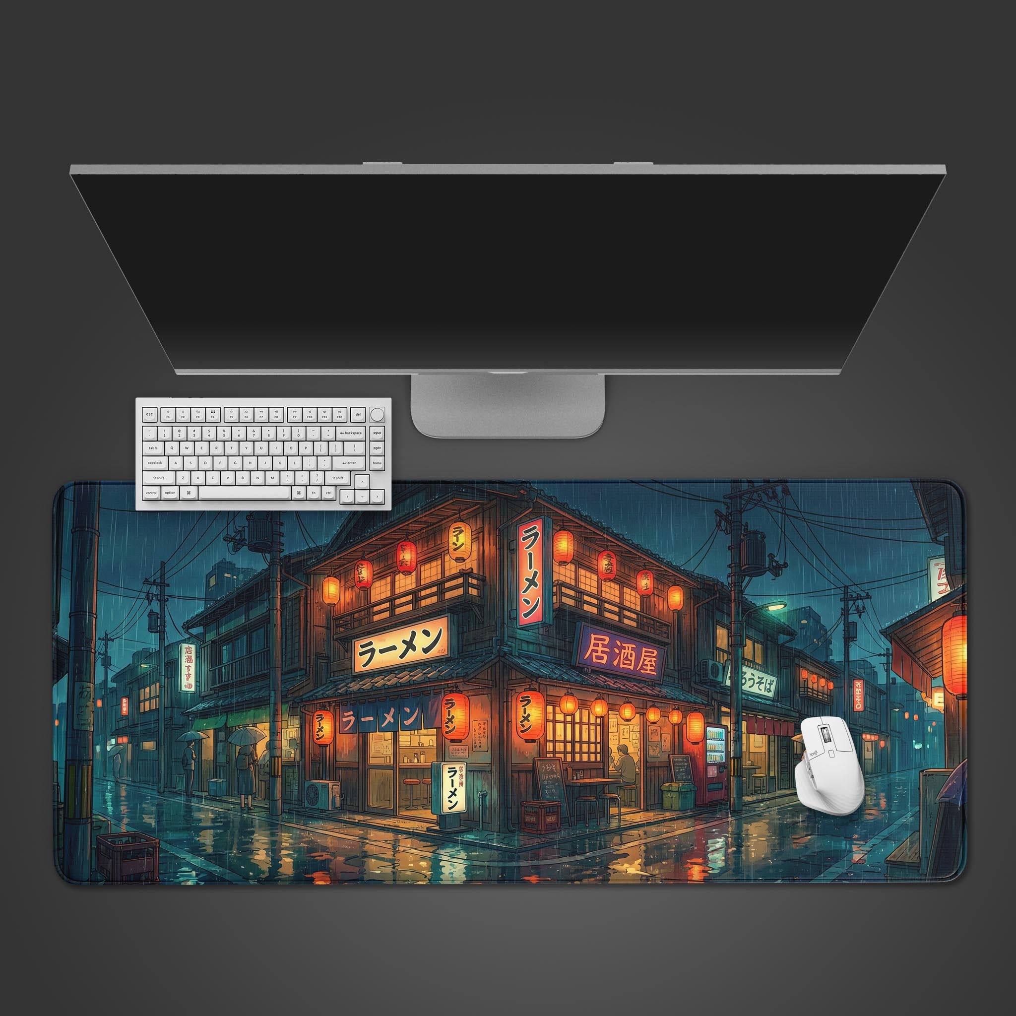 The Rainy District Gaming Desk Mat shown from above, with a white keyboard and mouse positioned on its anime-inspired illustration of a rainy Japanese street at night. - Epic Design Pads & Mousepads