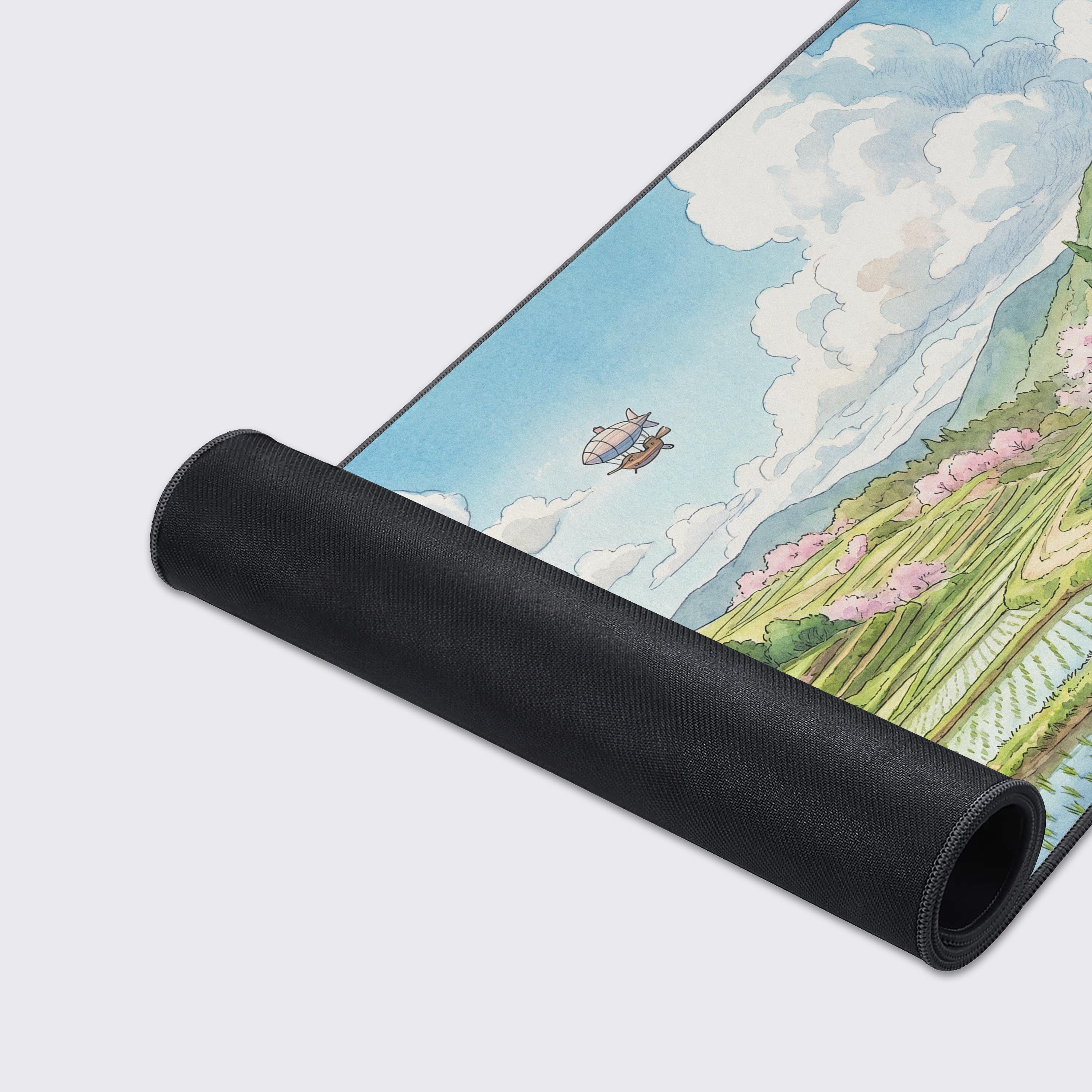 Detailed view of the watermill and stone ruins on the serene nature landscape gaming desk pad.